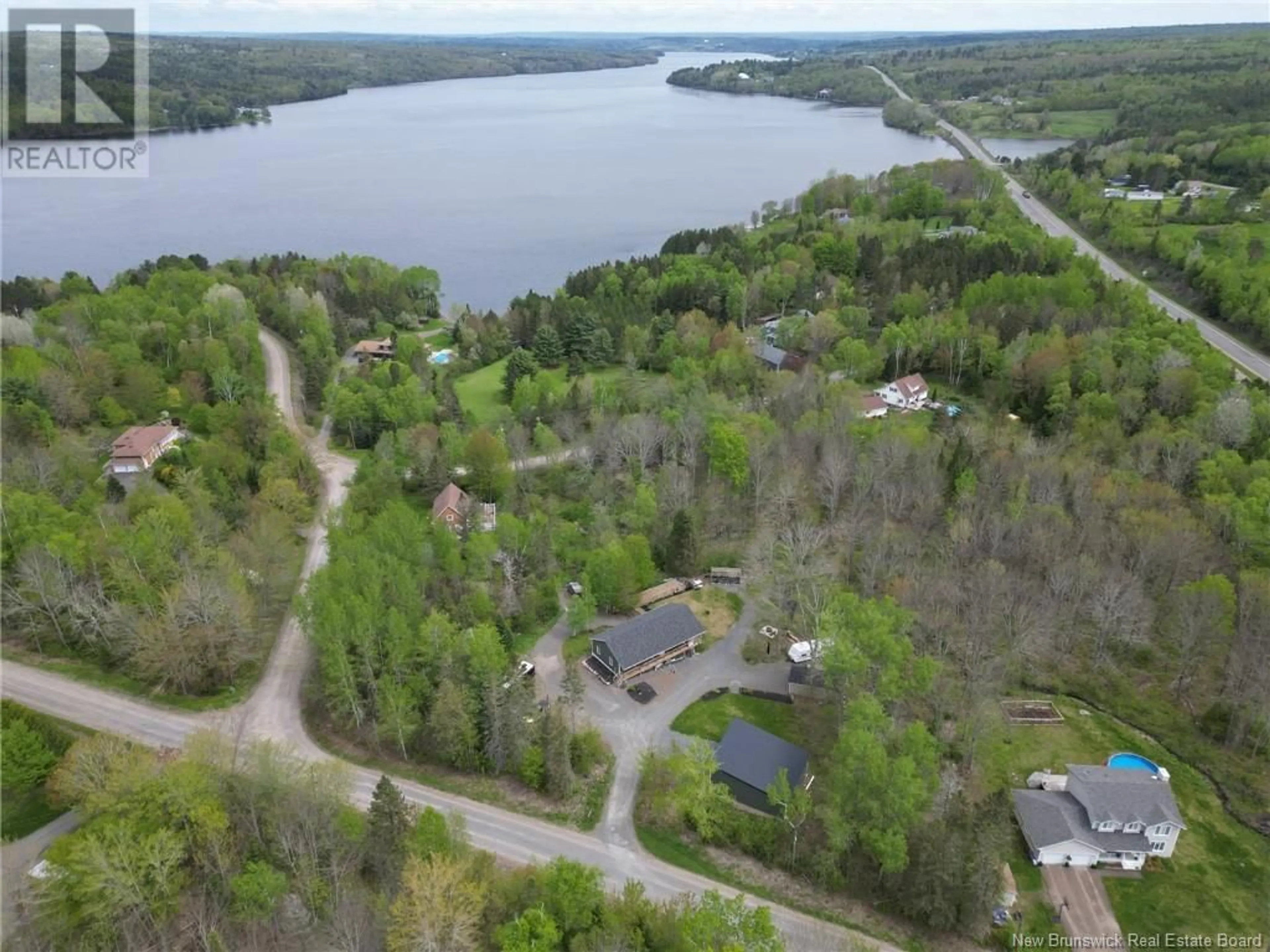 A pic from outside/outdoor area/front of a property/back of a property/a pic from drone, water/lake/river/ocean view for 18 DRIFTWOOD DRIVE, Hanwell New Brunswick E3E2R8