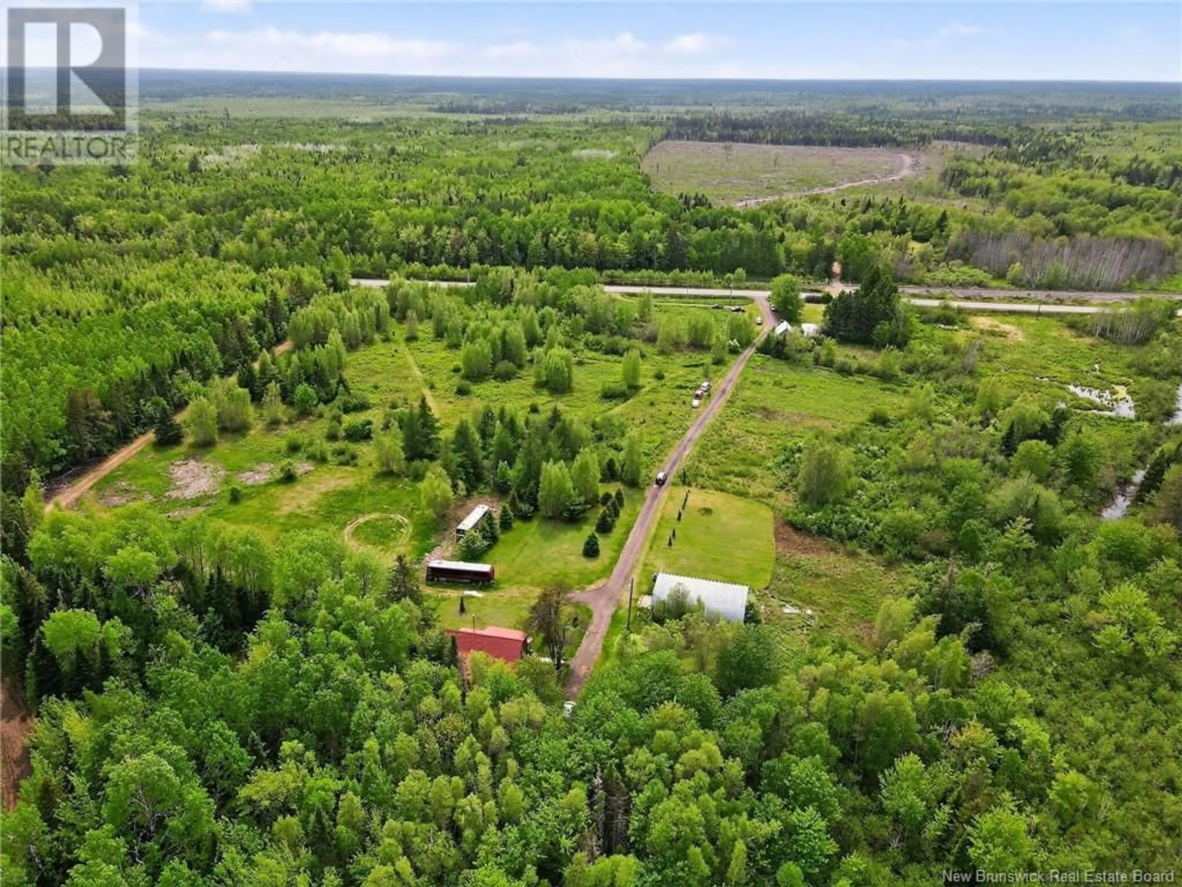 A pic from outside/outdoor area/front of a property/back of a property/a pic from drone, forest/trees view for 8387 126 ROUTE, Harcourt New Brunswick E4T2Z9