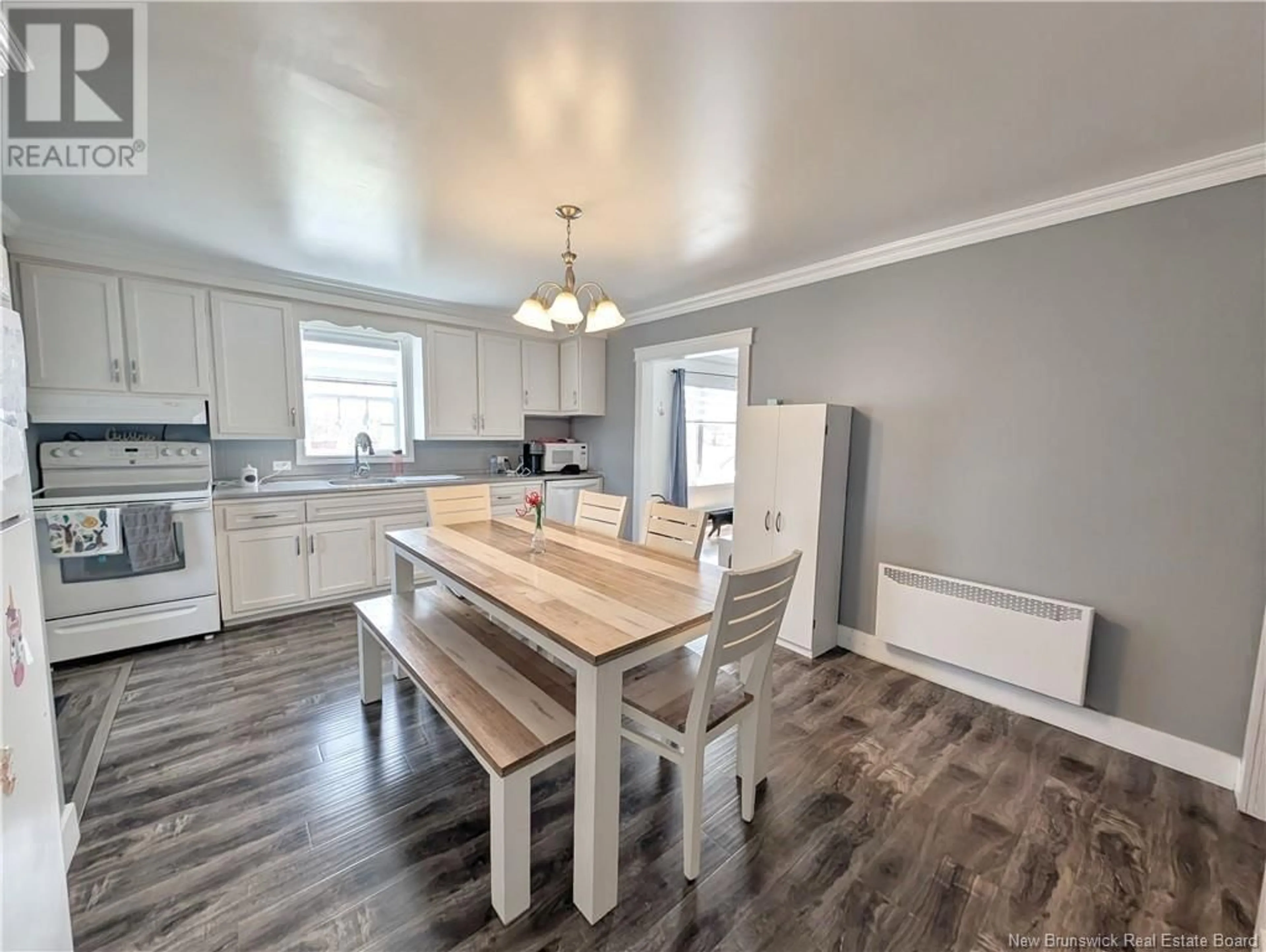 Open concept kitchen, wood/laminate floor for 22 DE LA SOURCE STREET, Le Goulet New Brunswick E8S1Z3