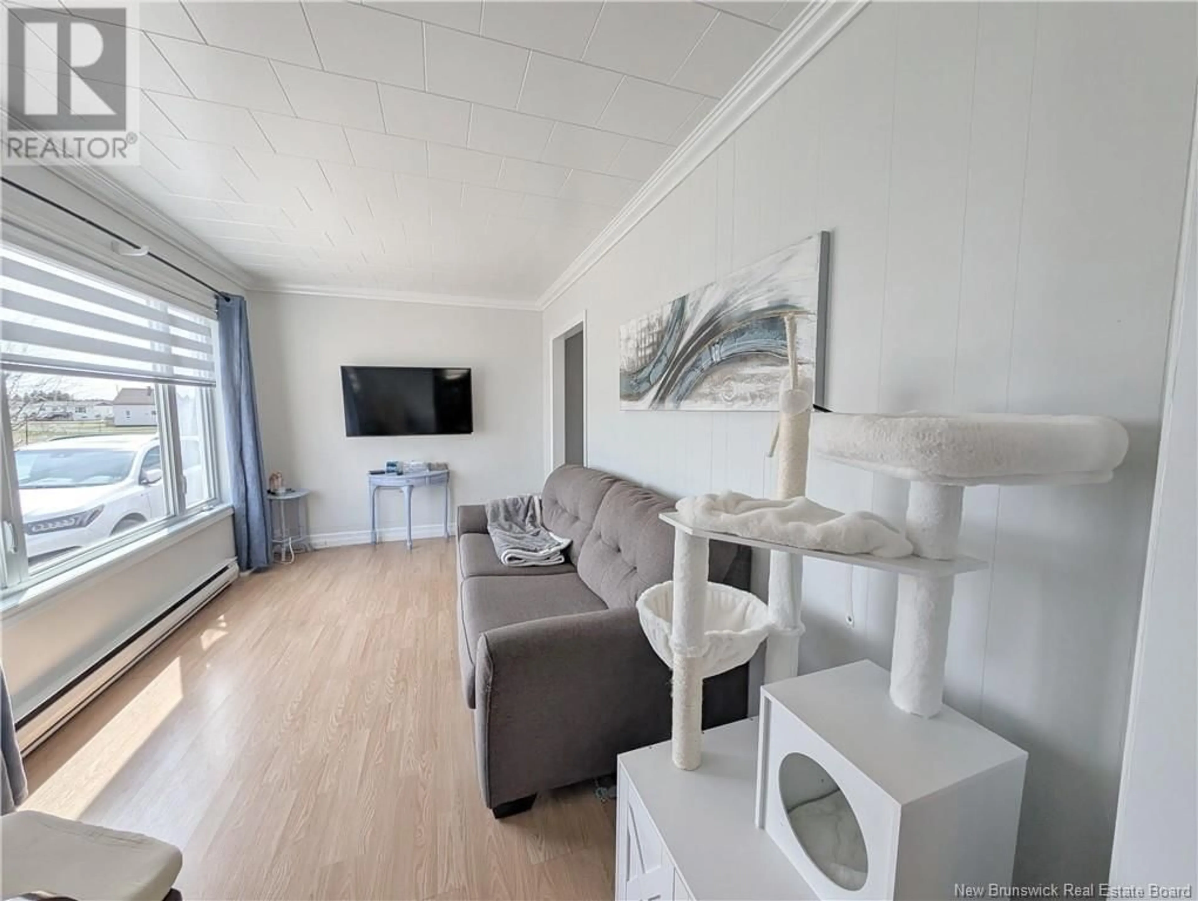 Living room with furniture, wood/laminate floor for 22 DE LA SOURCE STREET, Le Goulet New Brunswick E8S1Z3