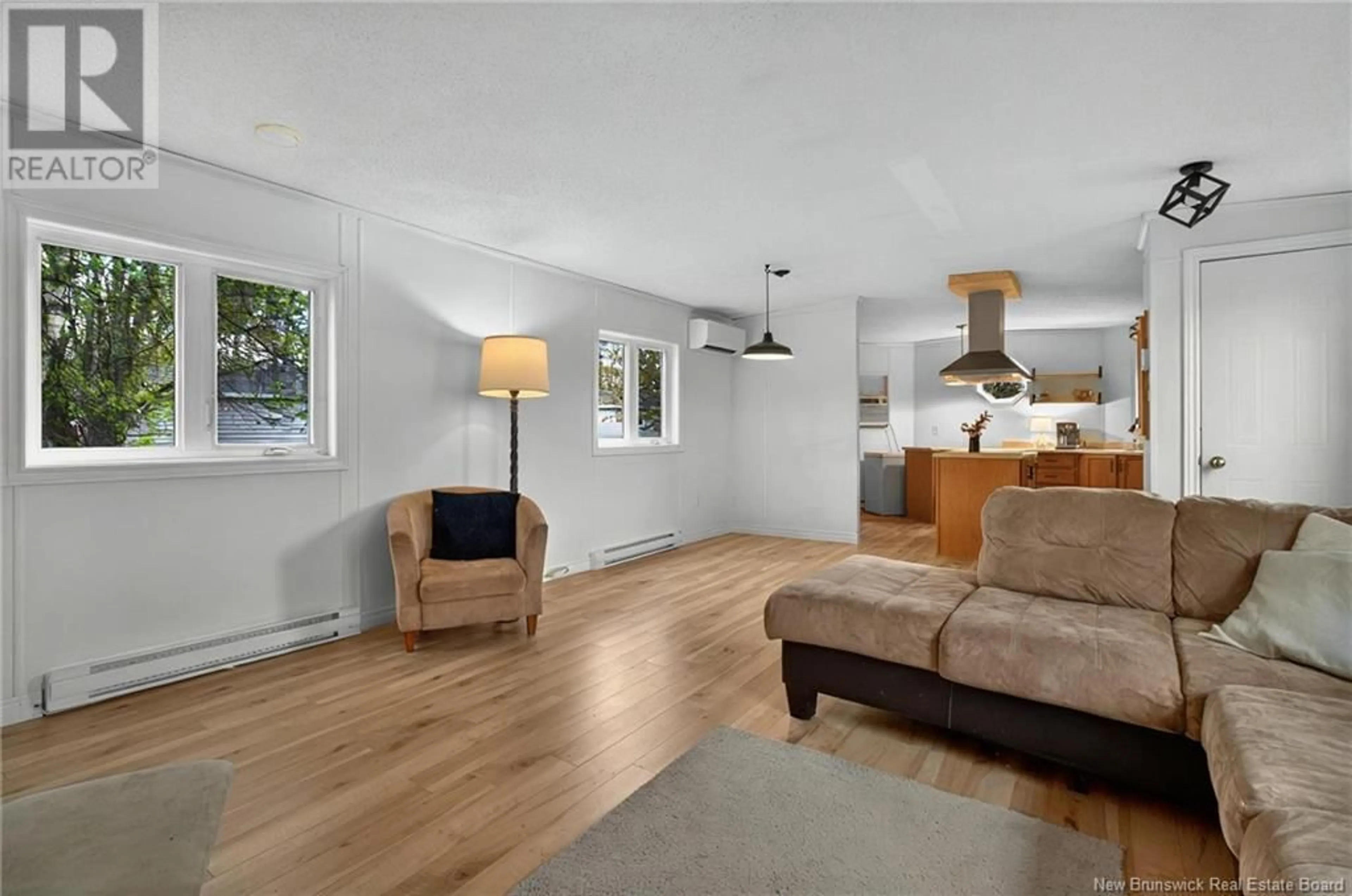 Living room with furniture, wood/laminate floor for 5 PURPLE MARTIN COURT, Moncton New Brunswick E1H2Z8
