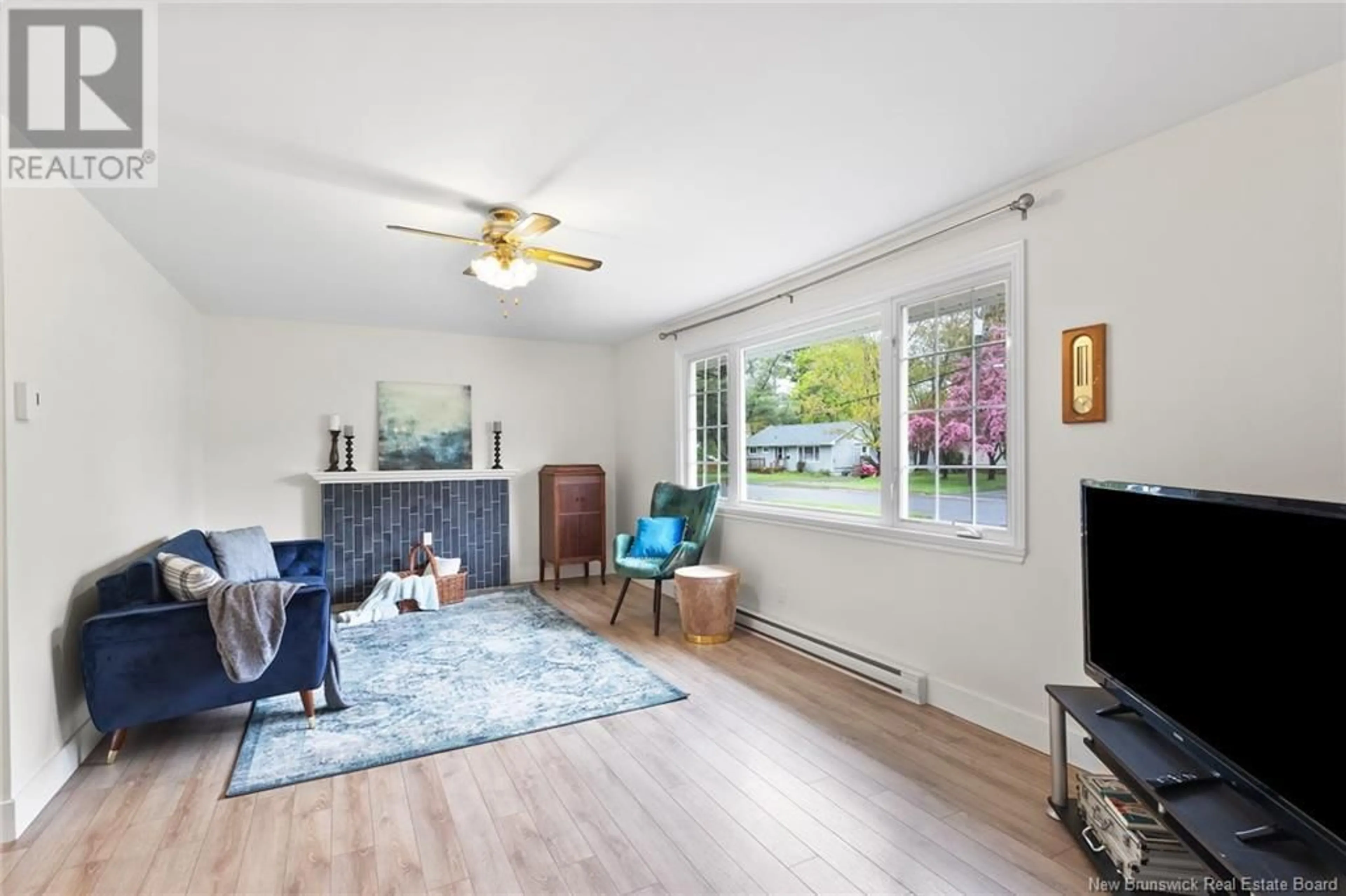 Living room with furniture, wood/laminate floor for 43 FLORAL AVENUE, Fredericton New Brunswick E3A1K8