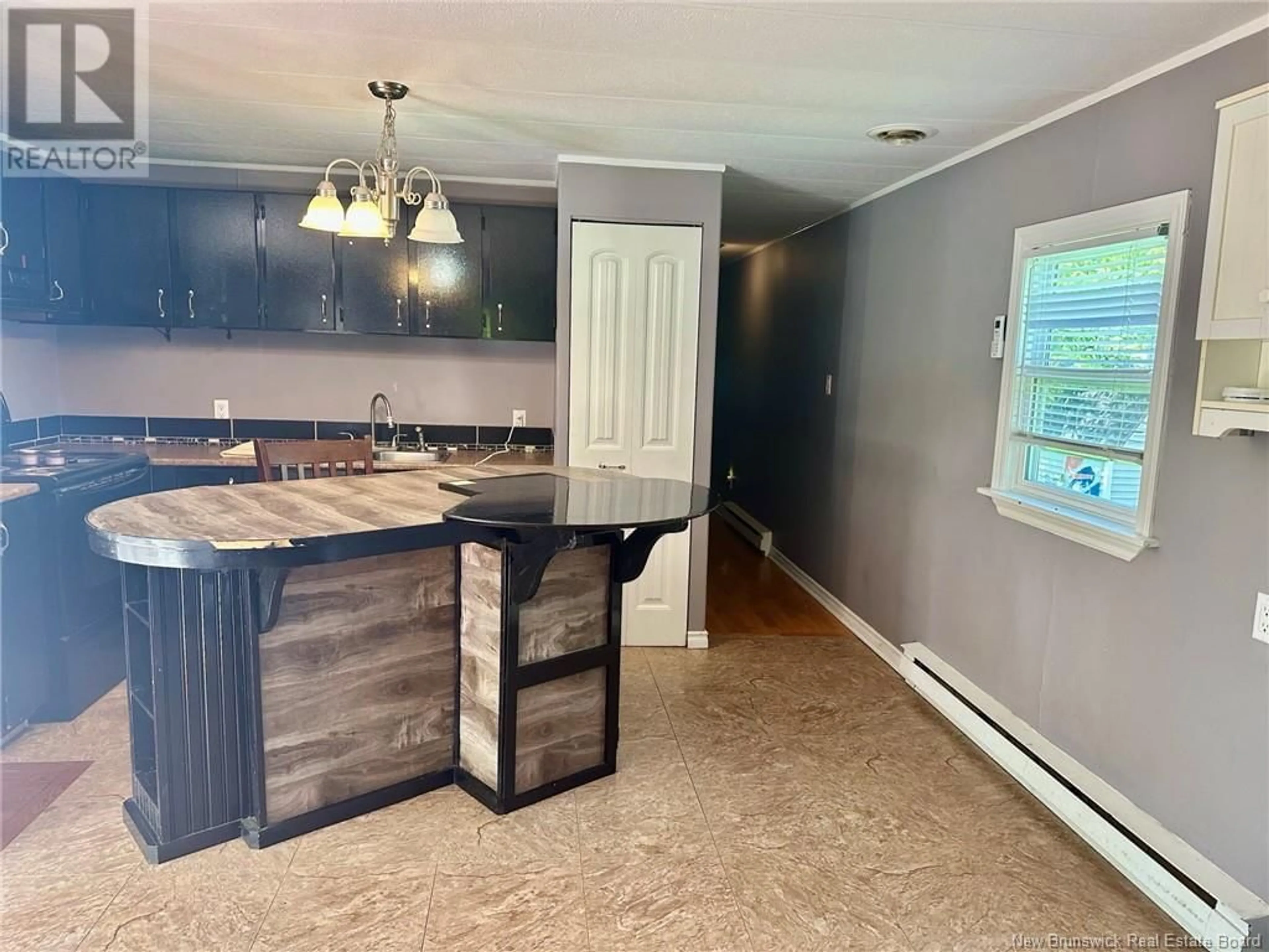 Open concept kitchen, wood/laminate floor for 31 RAMSEY STREET, Lincoln New Brunswick E3B6X1