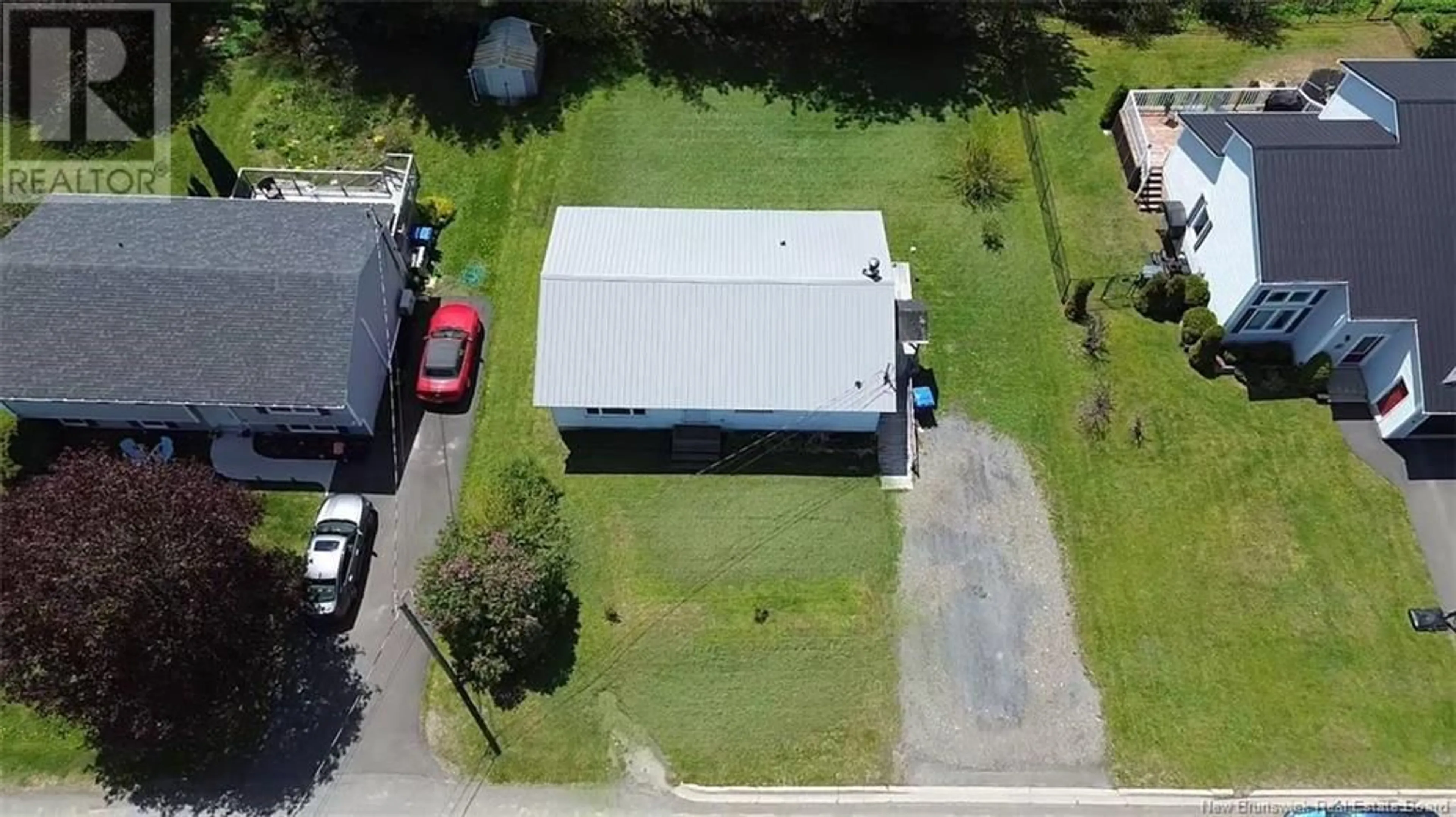 A pic from outside/outdoor area/front of a property/back of a property/a pic from drone, building for 133 EASTWOOD DRIVE, Woodstock New Brunswick E7M1P7