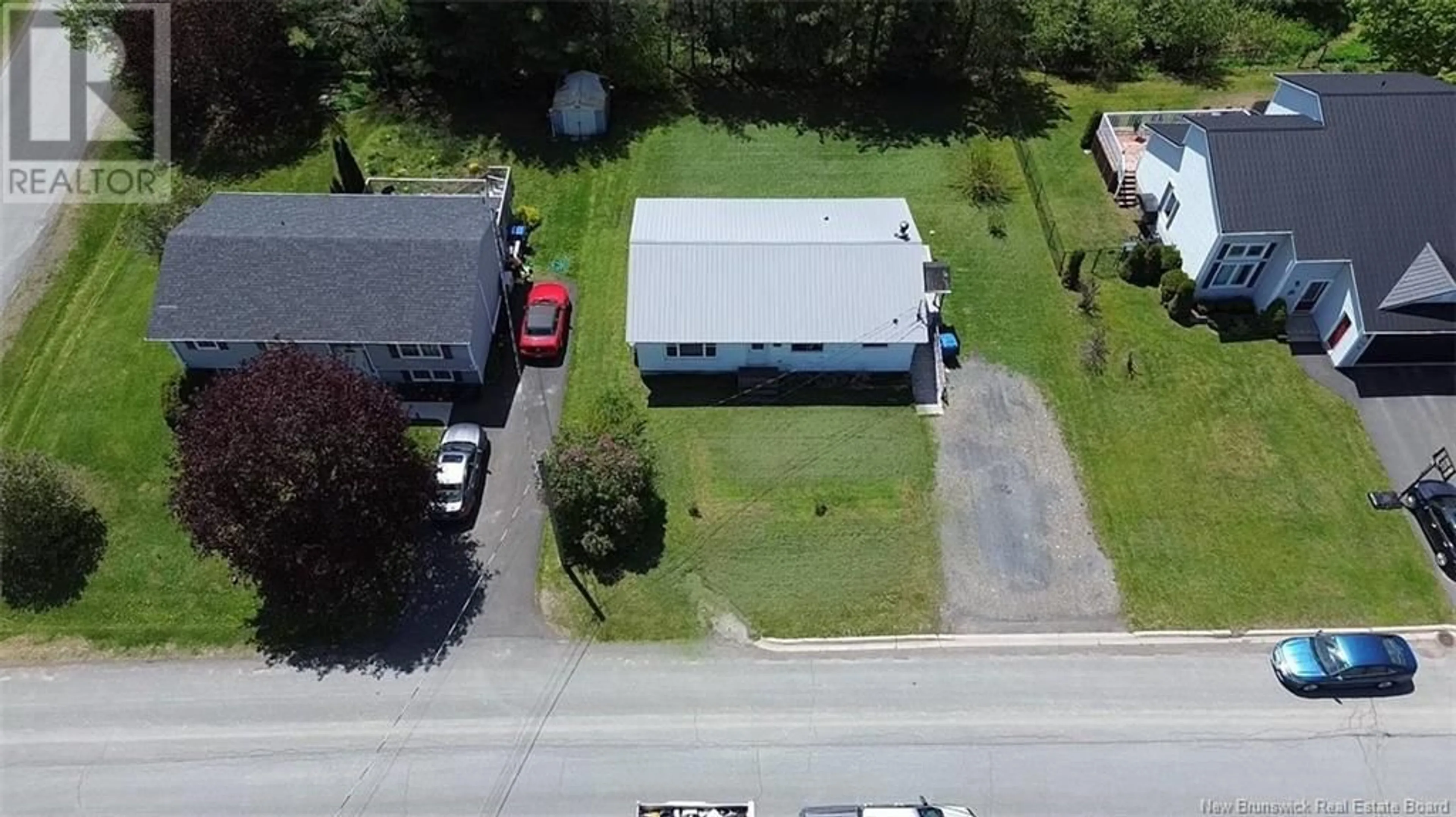 A pic from outside/outdoor area/front of a property/back of a property/a pic from drone, street for 133 EASTWOOD DRIVE, Woodstock New Brunswick E7M1P7