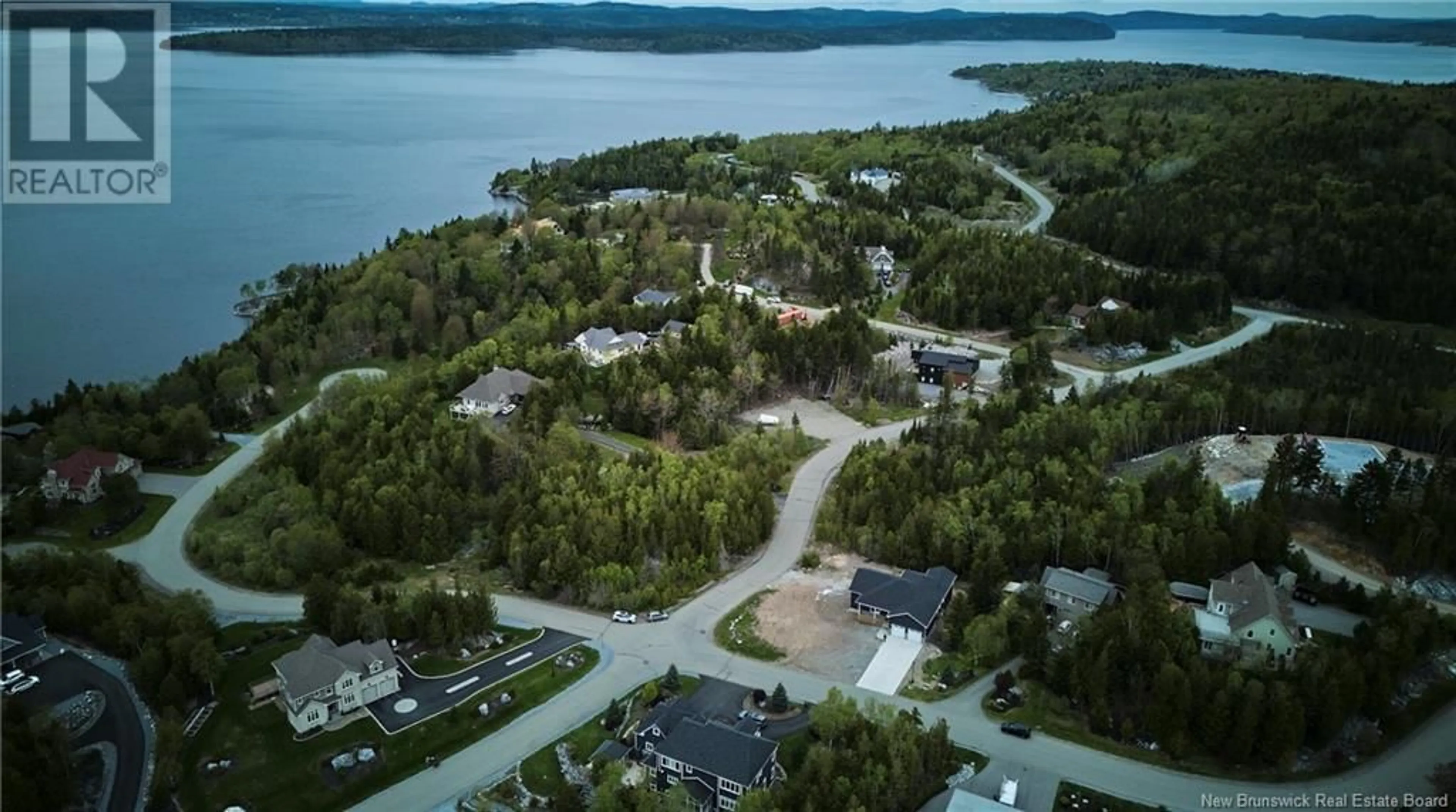 A pic from outside/outdoor area/front of a property/back of a property/a pic from drone, water/lake/river/ocean view for 70 FOX POINT DRIVE, Saint John New Brunswick E2H2Z6