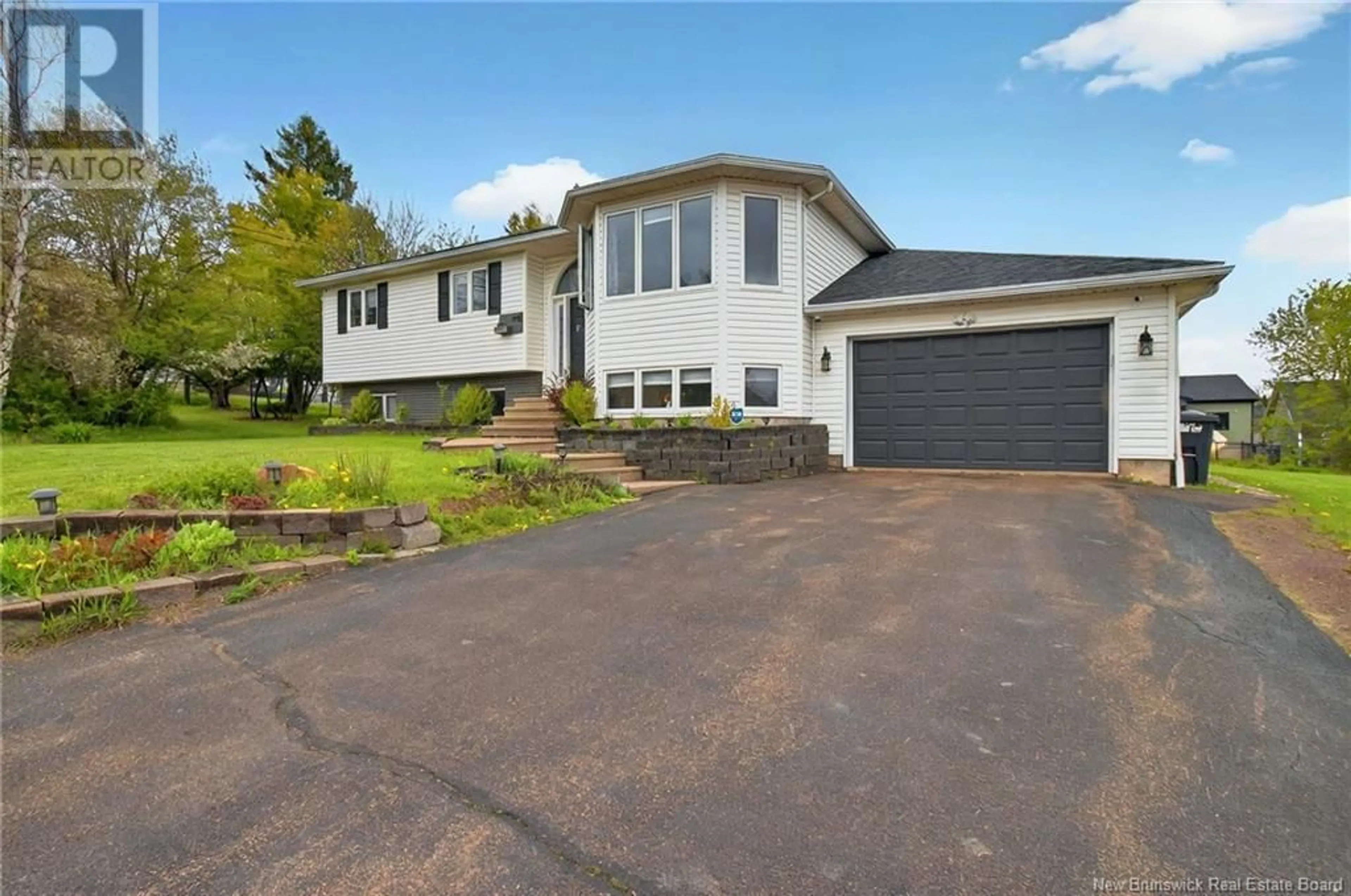Home with vinyl exterior material, street for 913 MELANSON ROAD, Dieppe New Brunswick E1A7P1