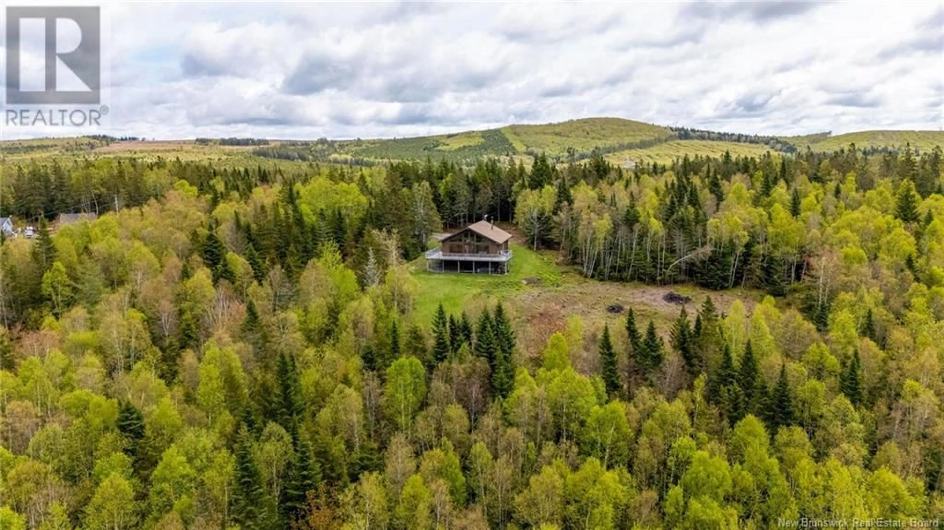A pic from outside/outdoor area/front of a property/back of a property/a pic from drone, forest/trees view for 50 SNOWFLAKE, Markhamville New Brunswick E2E4J3