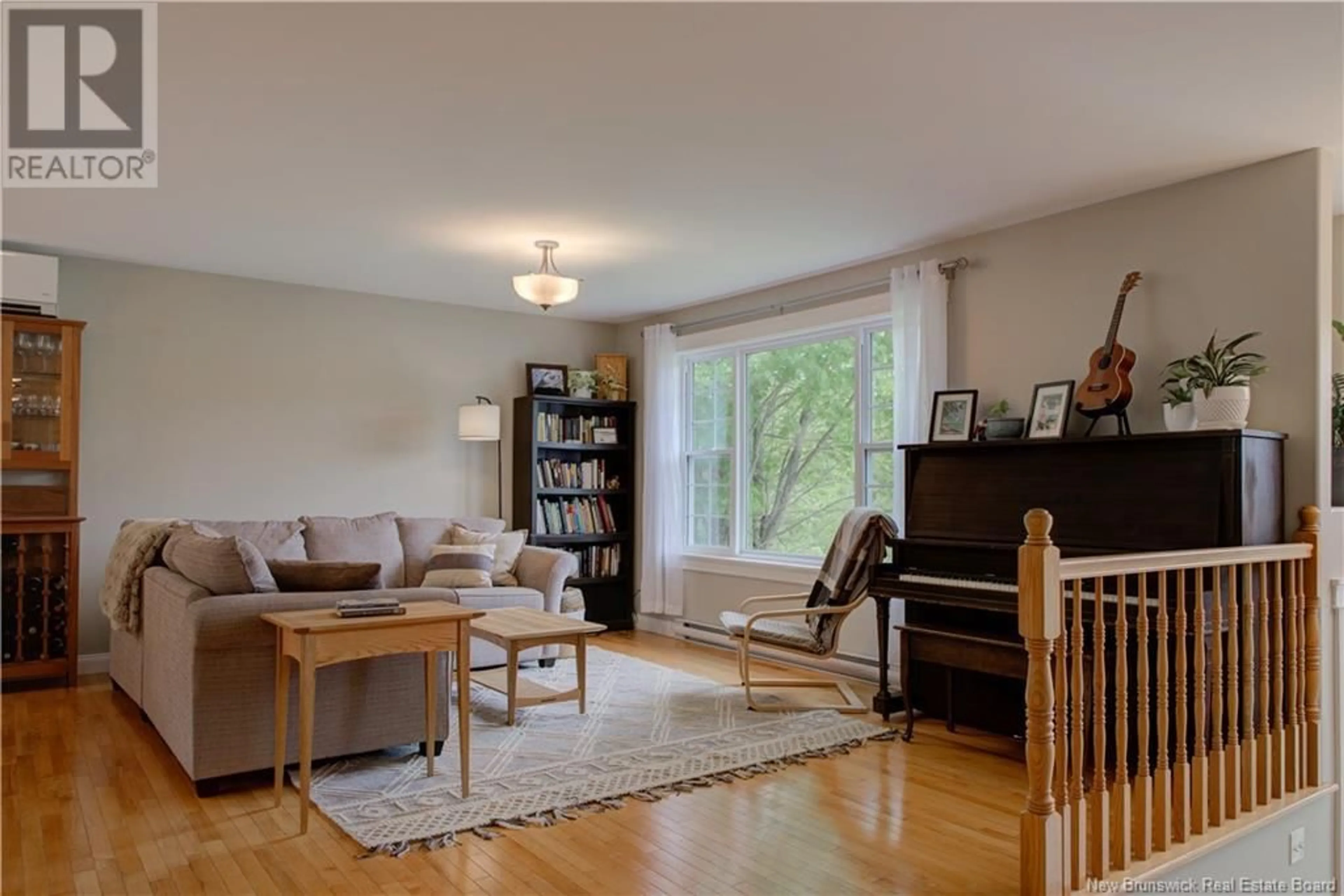 Living room with furniture, wood/laminate floor for 177 MATAYA DRIVE, Richibucto Road New Brunswick E3A0A5