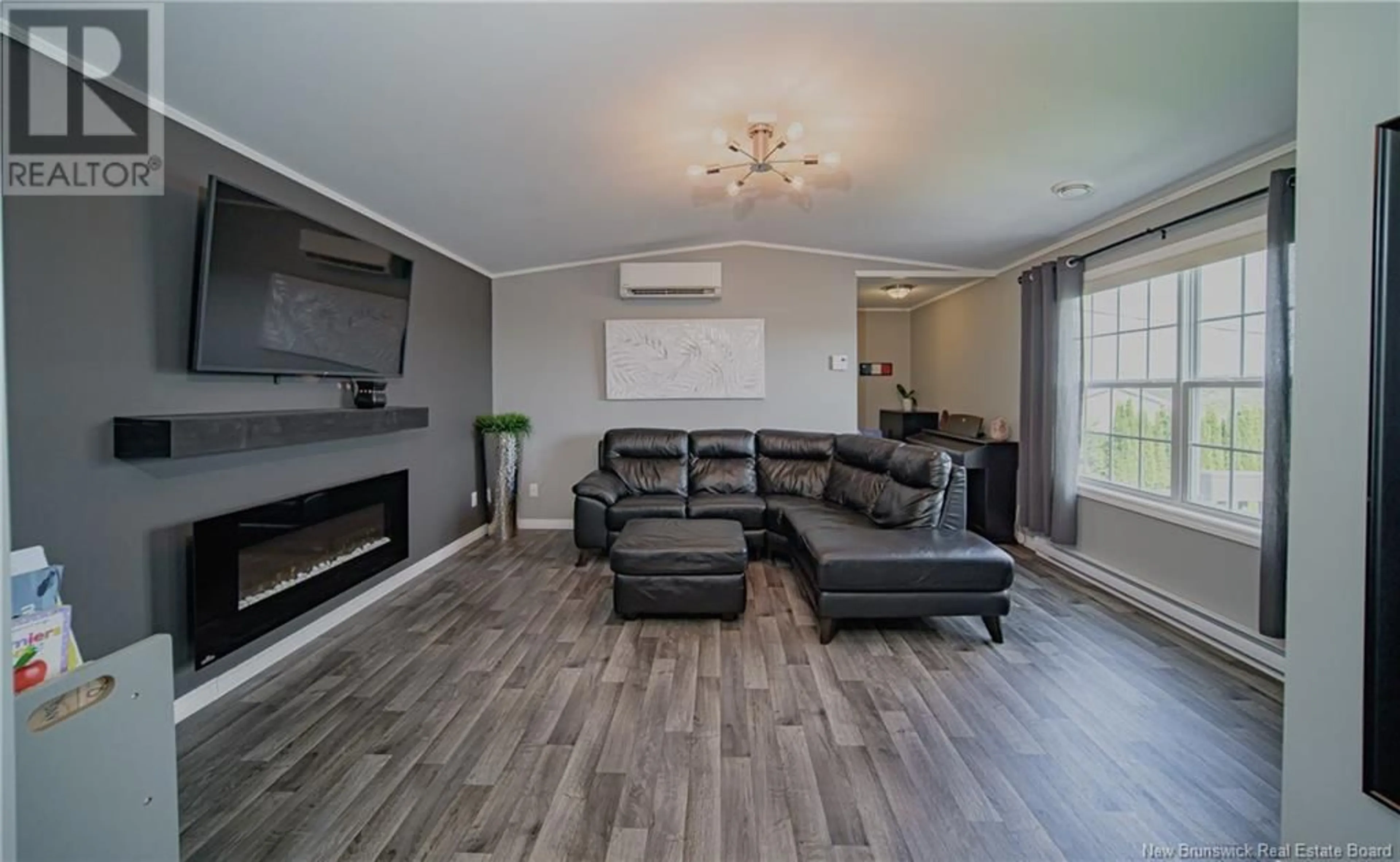 Living room with furniture, wood/laminate floor for 19 SHERRY'S LANE, Fredericton New Brunswick E3C1L8