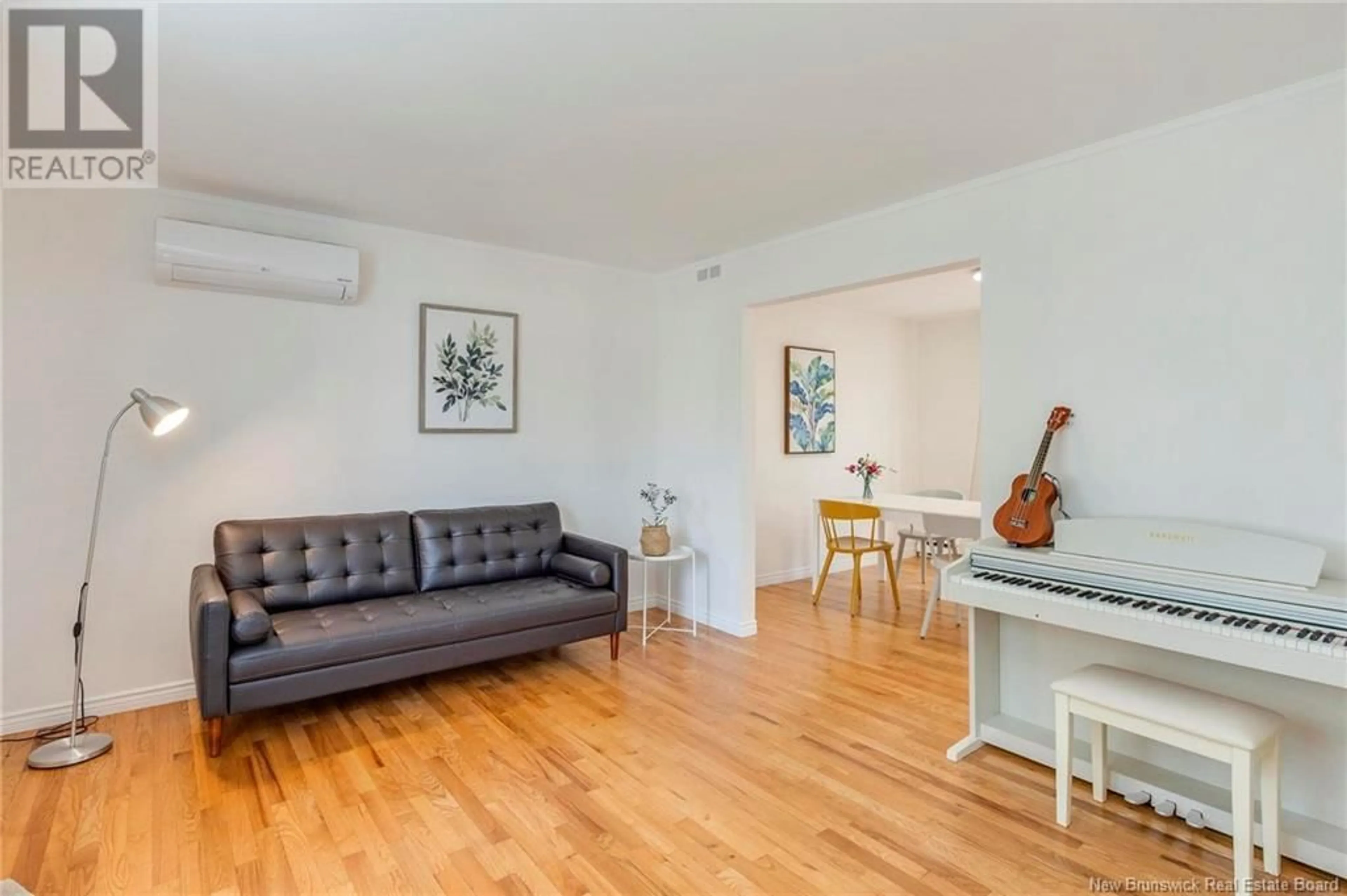 Living room with furniture, wood/laminate floor for 180 SHANNON DRIVE, Moncton New Brunswick E1G2G6