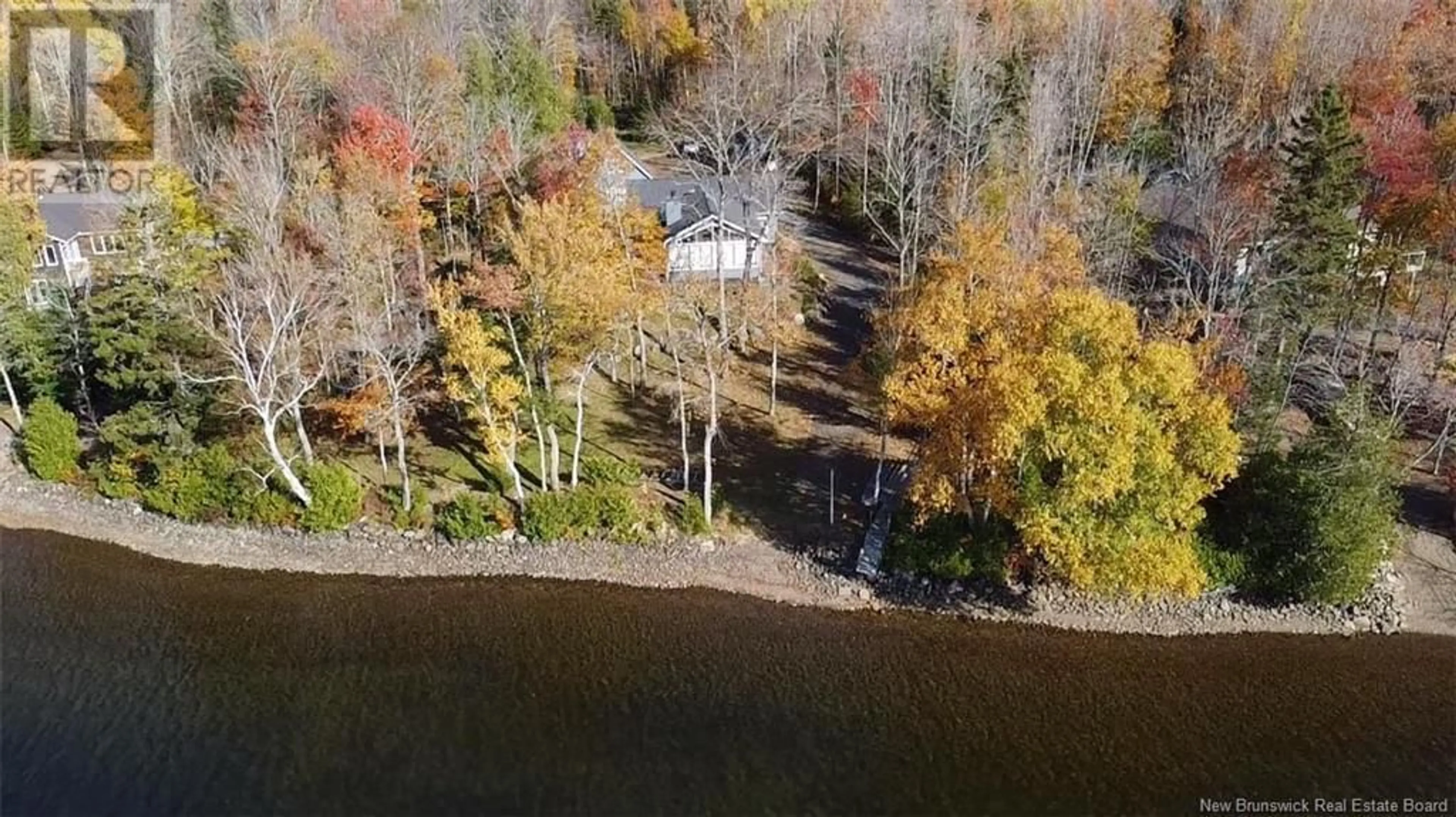 A pic from outside/outdoor area/front of a property/back of a property/a pic from drone, water/lake/river/ocean view for 173 GRAYSON LANE, East Grand Lake New Brunswick E6H1Y5