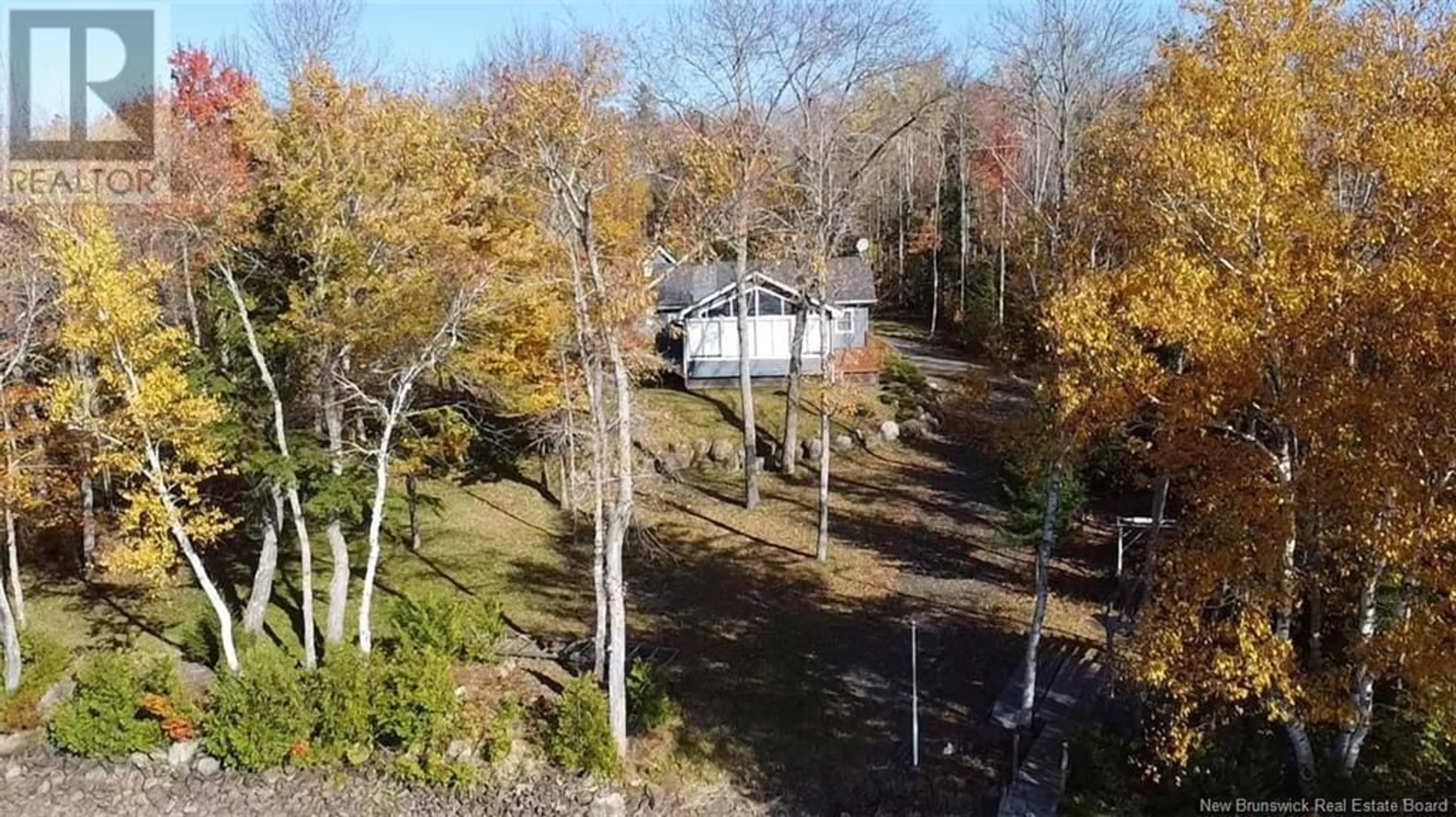 A pic from outside/outdoor area/front of a property/back of a property/a pic from drone, forest/trees view for 173 GRAYSON LANE, East Grand Lake New Brunswick E6H1Y5