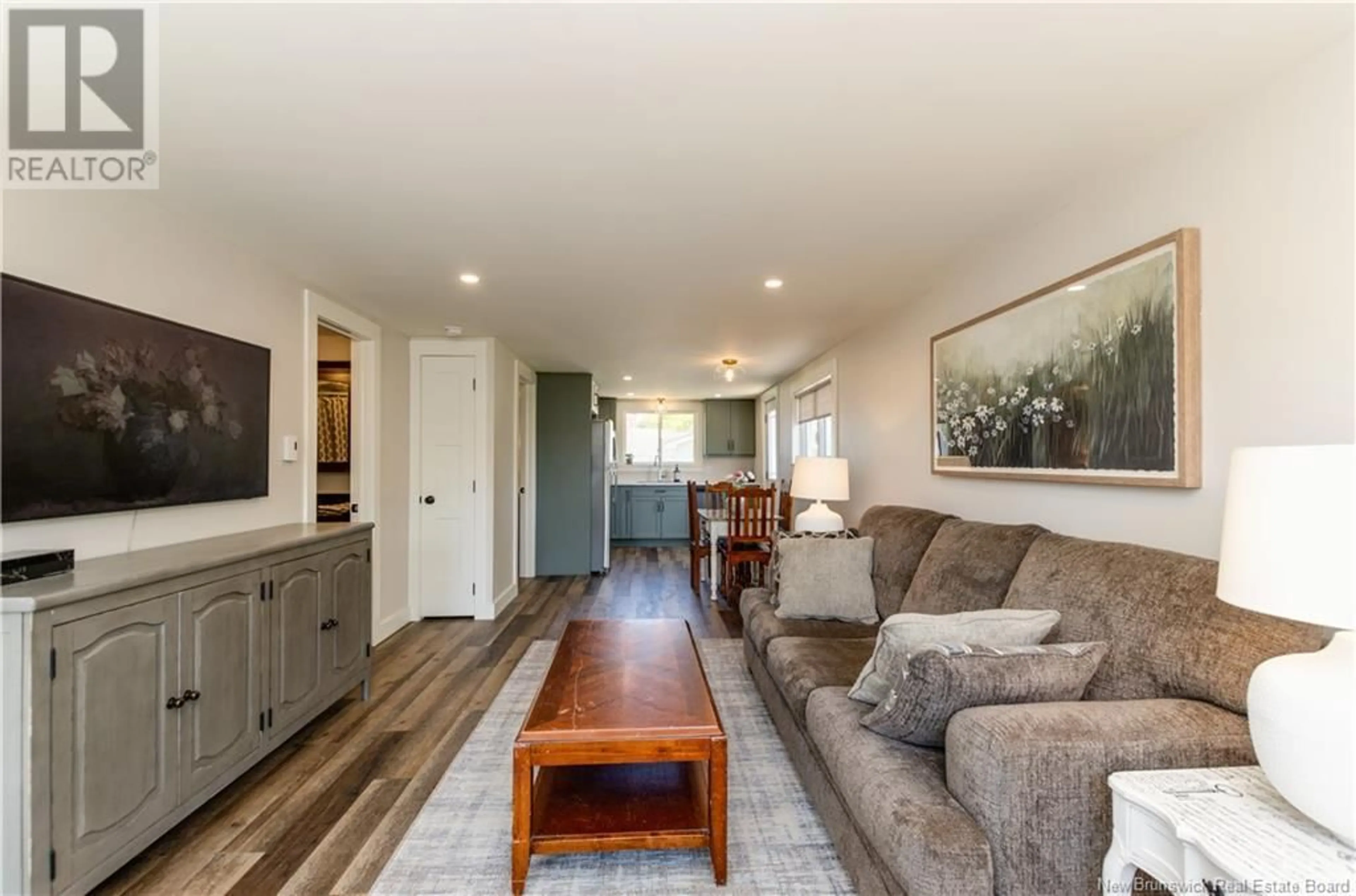 Living room with furniture, wood/laminate floor for 25 ST JEAN BAPTISTE, Bouctouche New Brunswick E4S3W1