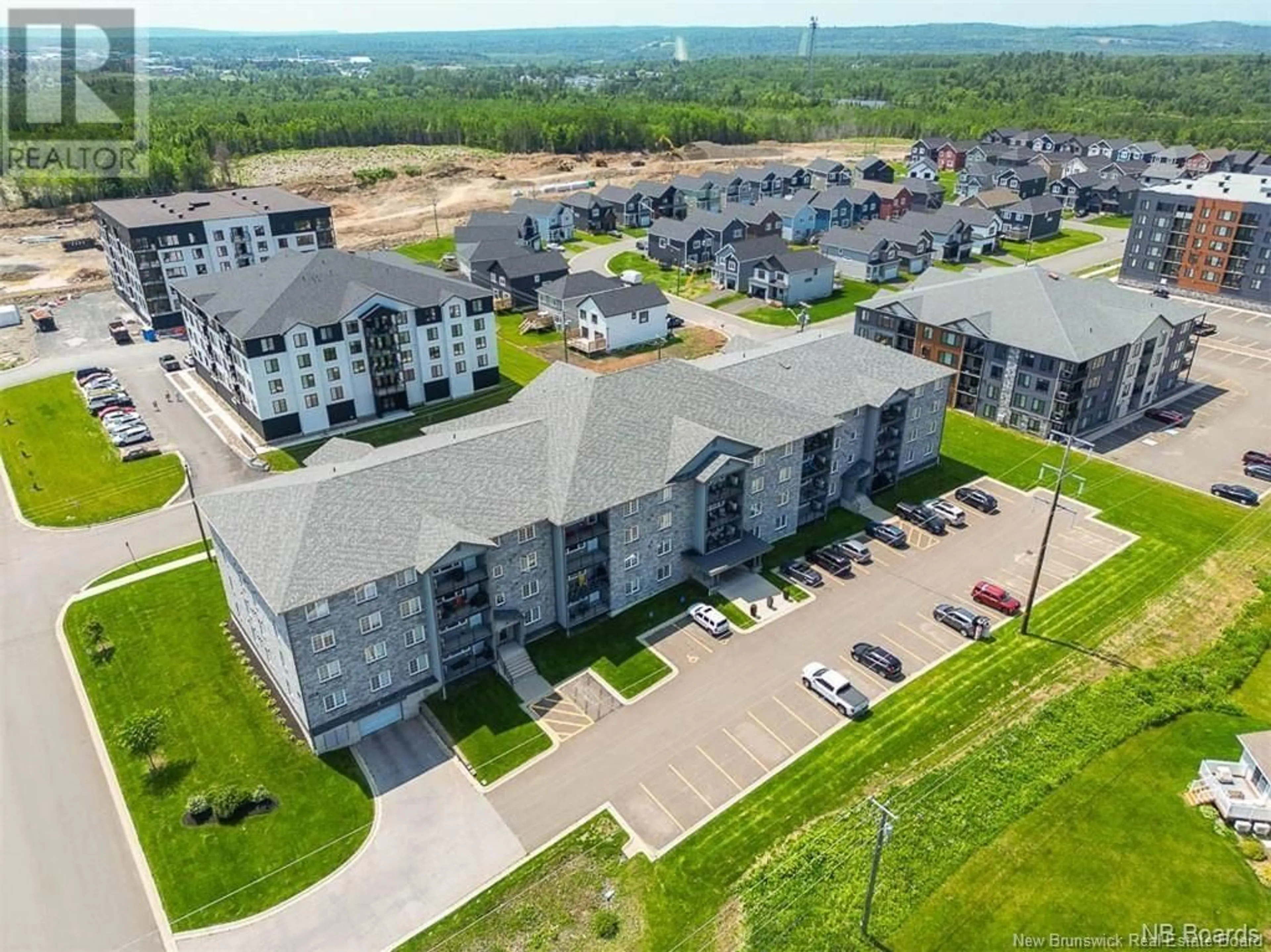 A pic from outside/outdoor area/front of a property/back of a property/a pic from drone, unknown for 211 - 155 LIAN STREET, Fredericton New Brunswick E3C1L9