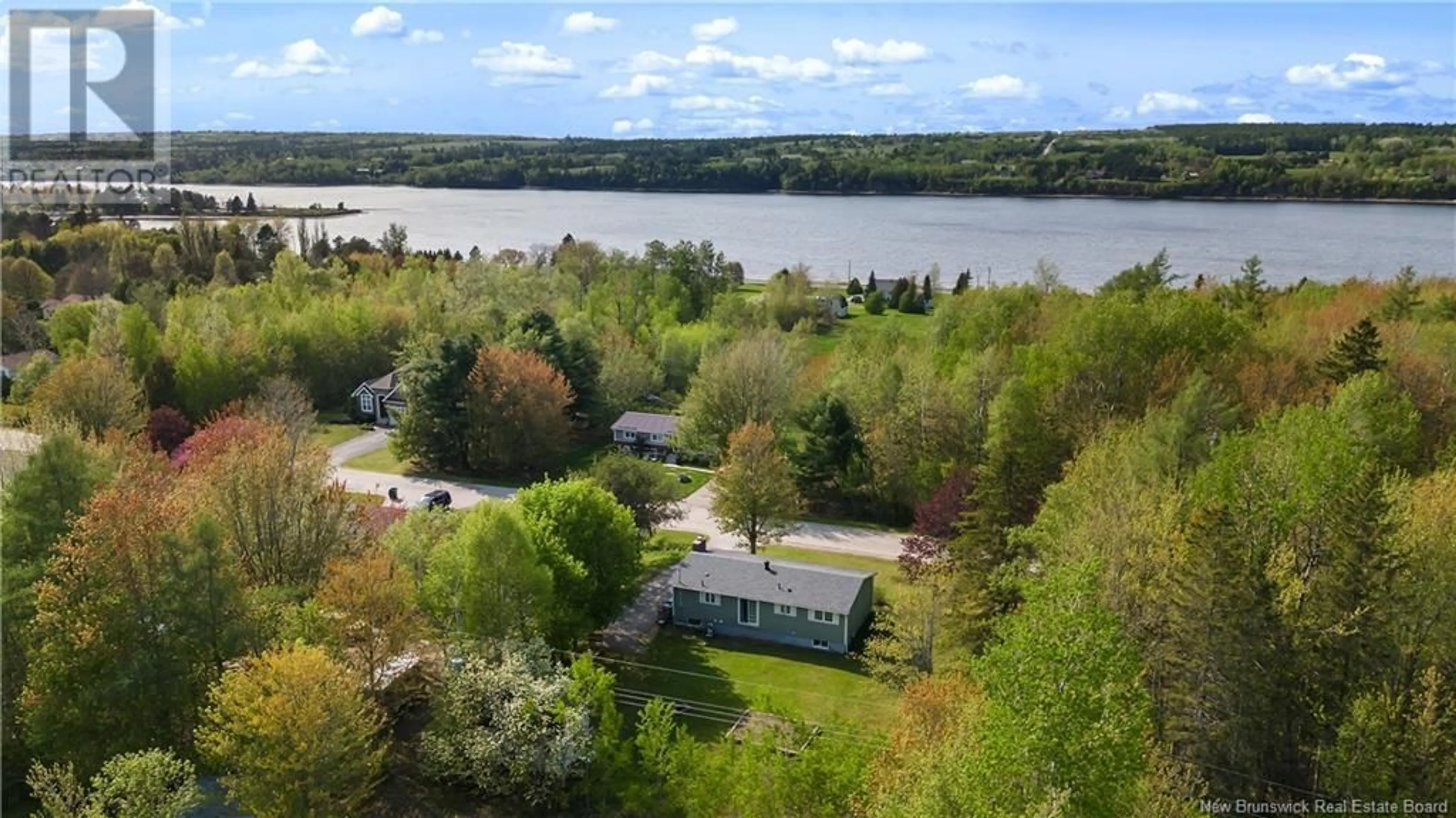 A pic from outside/outdoor area/front of a property/back of a property/a pic from drone, water/lake/river/ocean view for 232 GERALYN DRIVE, Miramichi New Brunswick E1N3T9