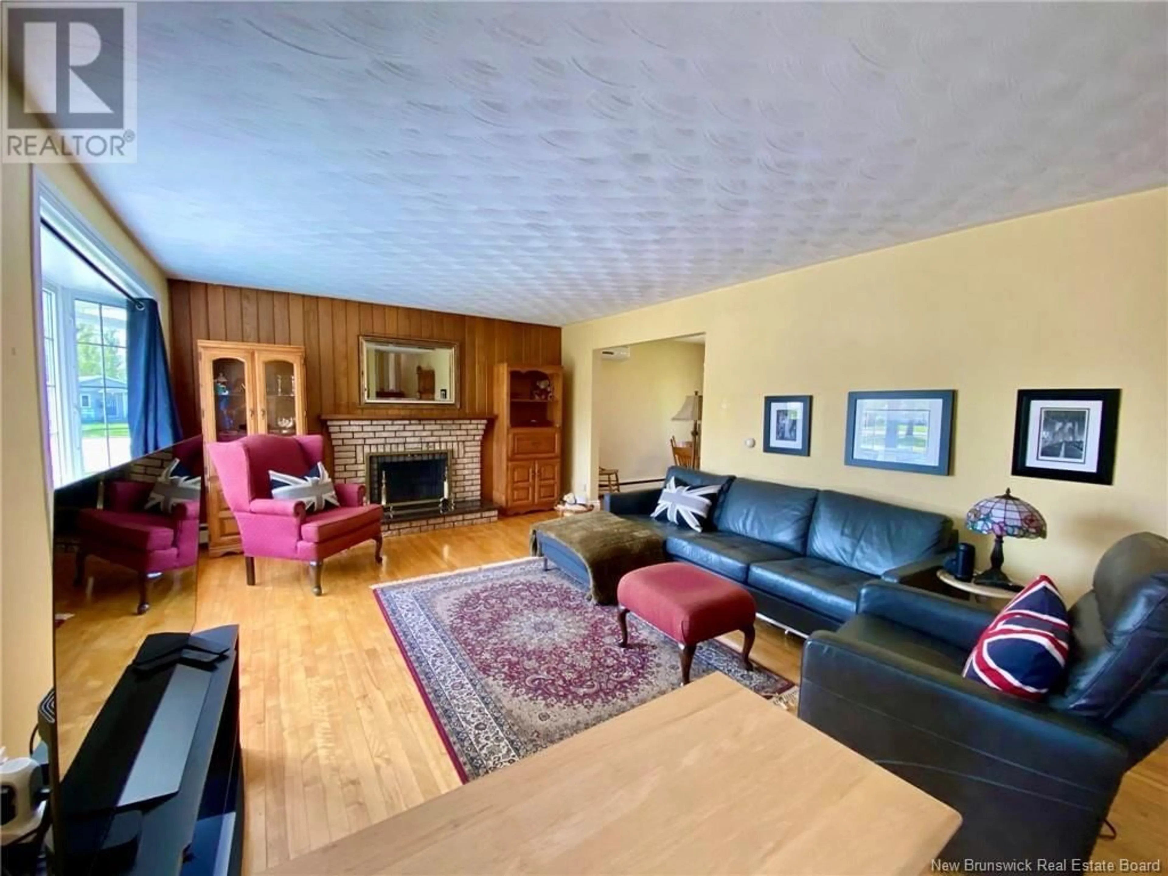 Living room with furniture, wood/laminate floor for 10 ROSEDALE AVENUE, Moncton New Brunswick E1A2T7