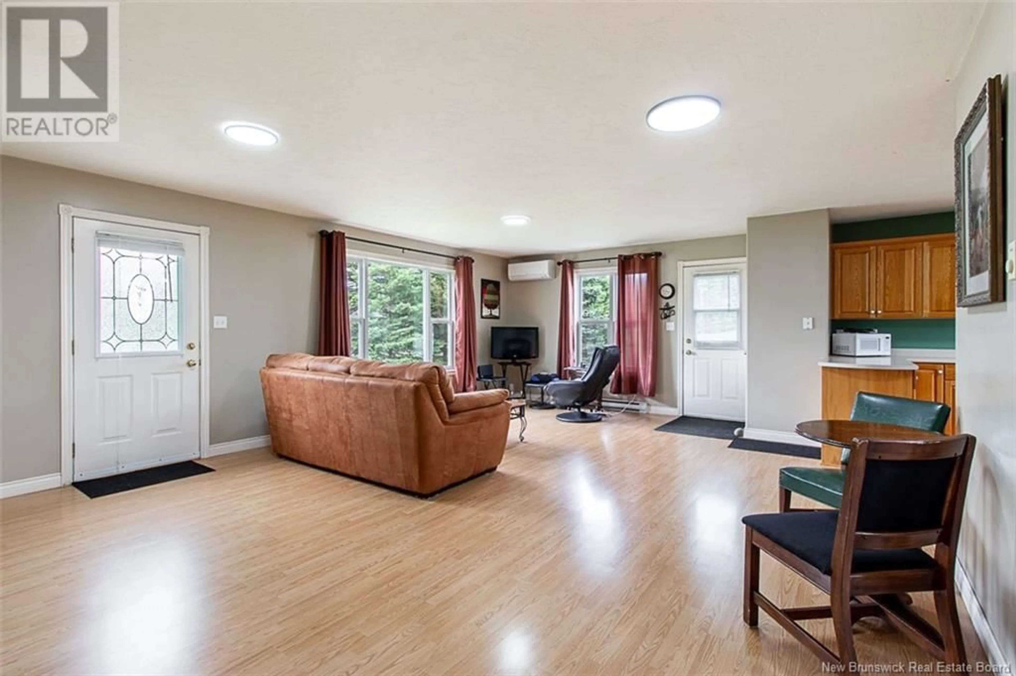 Living room with furniture, wood/laminate floor for 387 ALLEE DE L'ECOLE, Grande-Digue New Brunswick E4R3S3