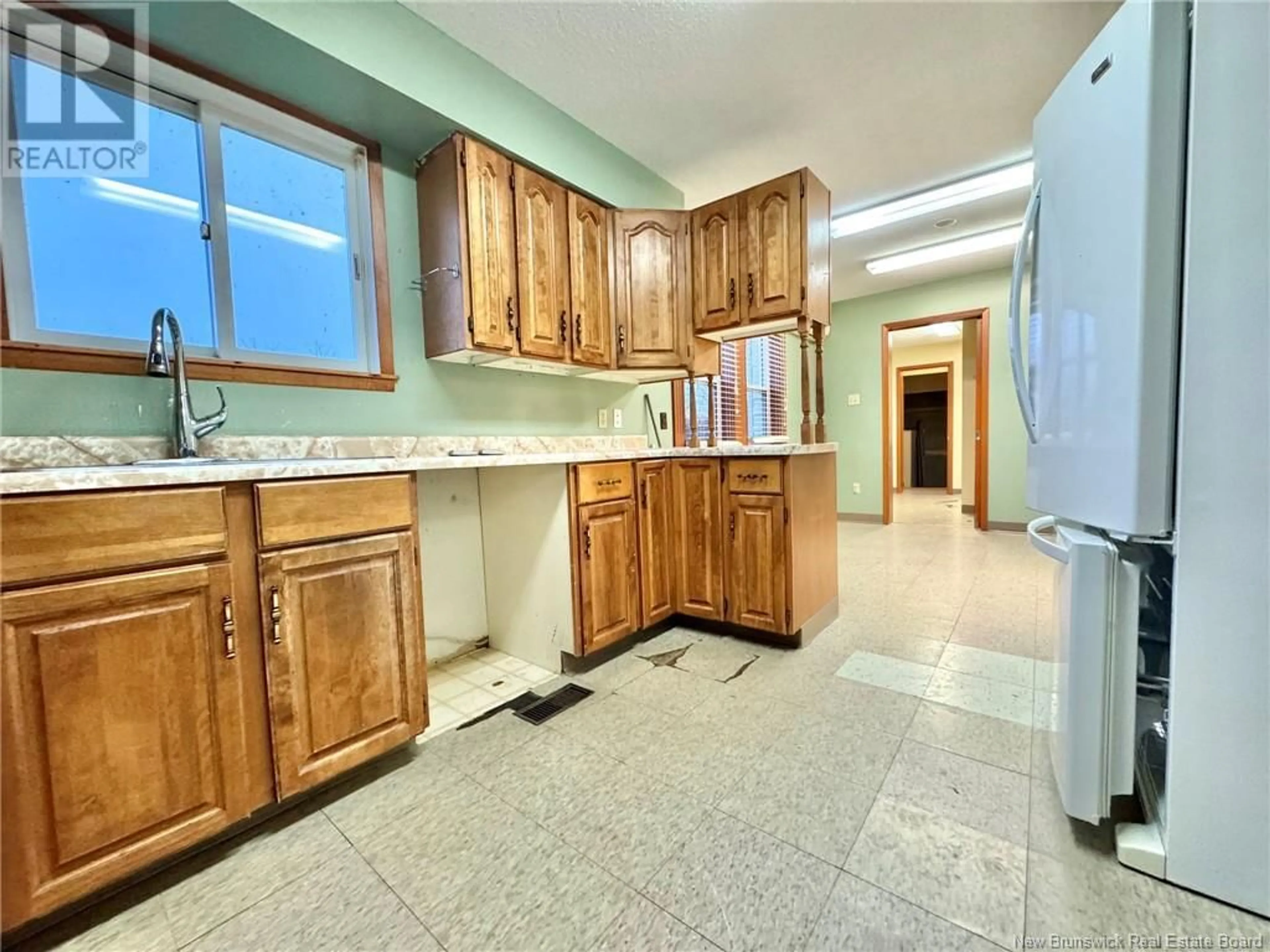 Kitchen with laundary machines, ceramic/tile floor for 183 KING STREET, Miramichi New Brunswick E1N2P1