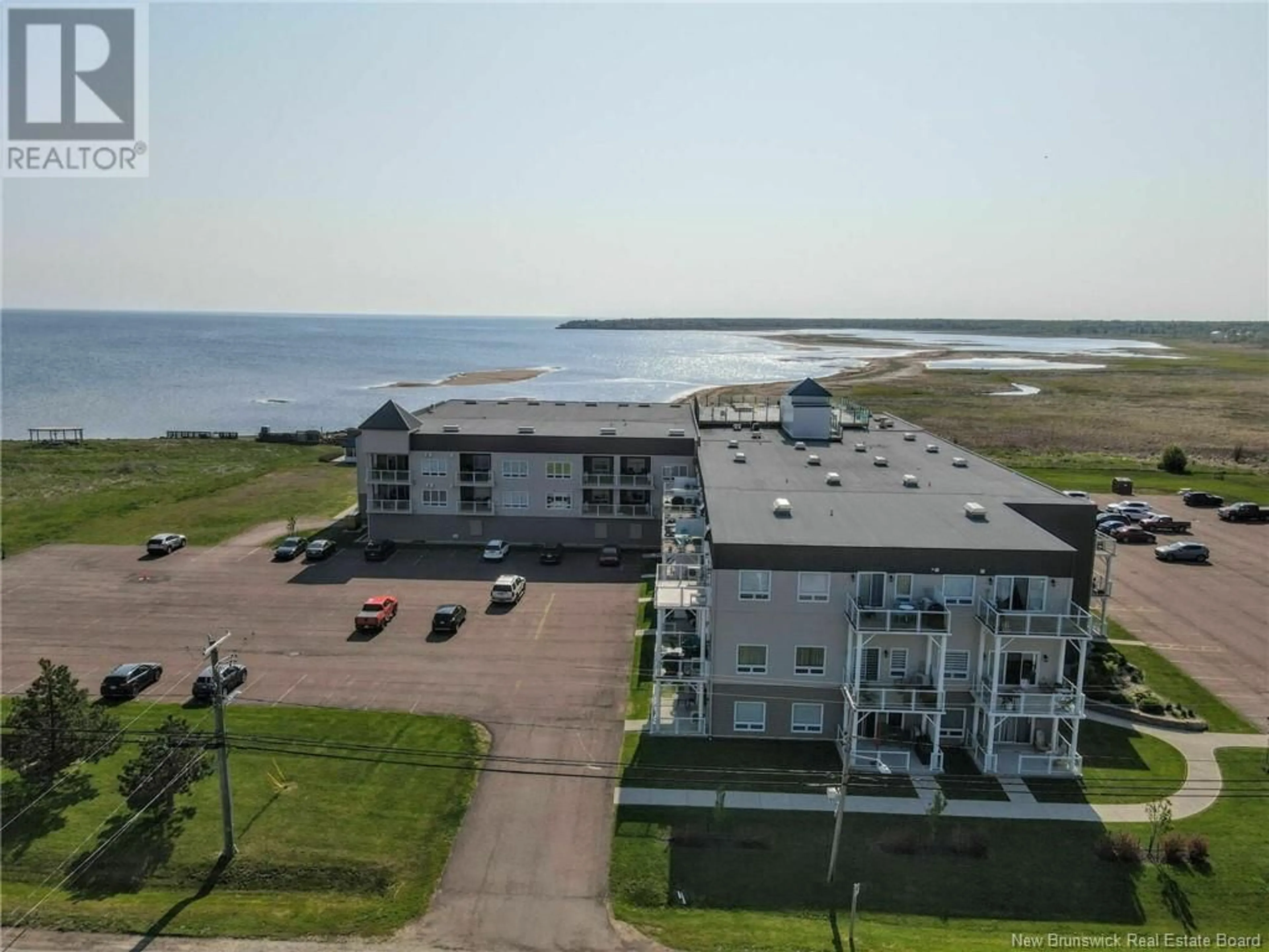 A pic from outside/outdoor area/front of a property/back of a property/a pic from drone, water/lake/river/ocean view for 105 - 69 CAP BIMET BOULEVARD, Grand-Barachois New Brunswick E4P6X5