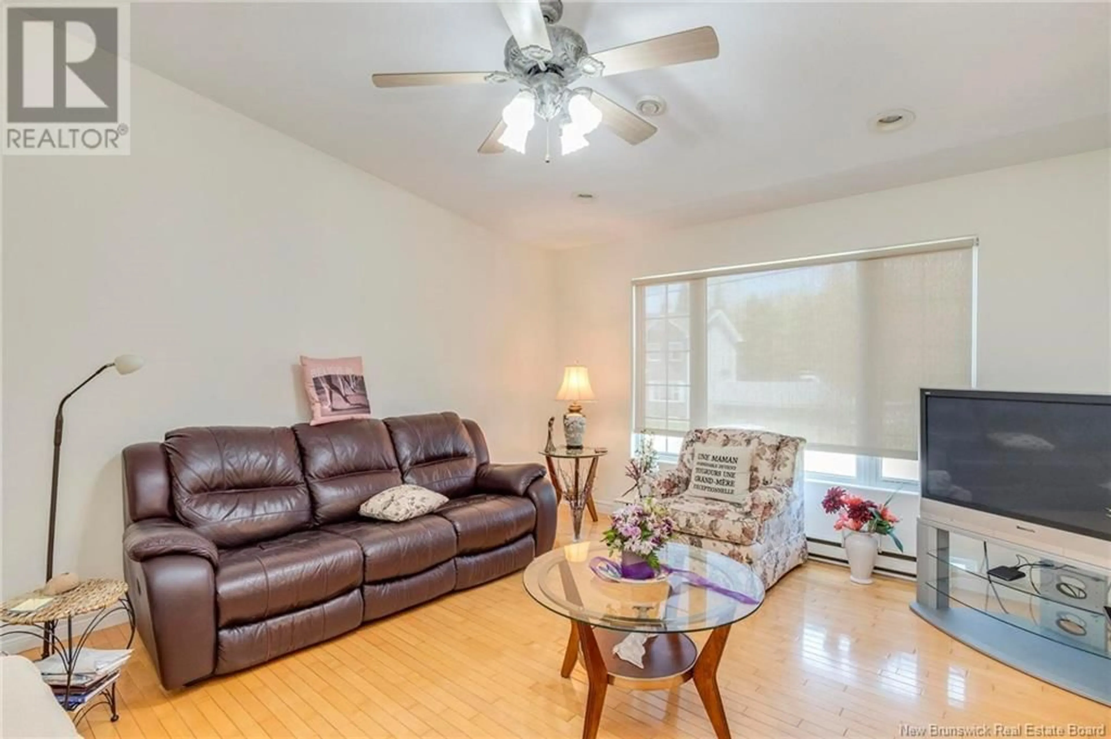 Living room with furniture, wood/laminate floor for 30 ALBERTA COURT, Dieppe New Brunswick E1A6Z1