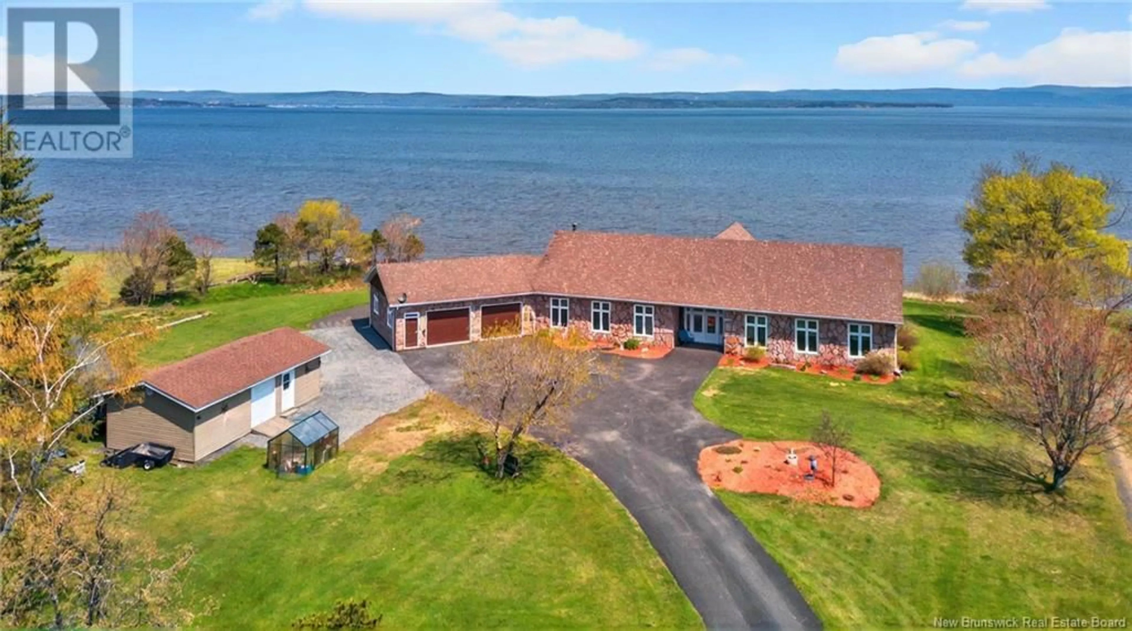 A pic from outside/outdoor area/front of a property/back of a property/a pic from drone, water/lake/river/ocean view for 447 CHALEUR STREET, Charlo New Brunswick E8E2B9