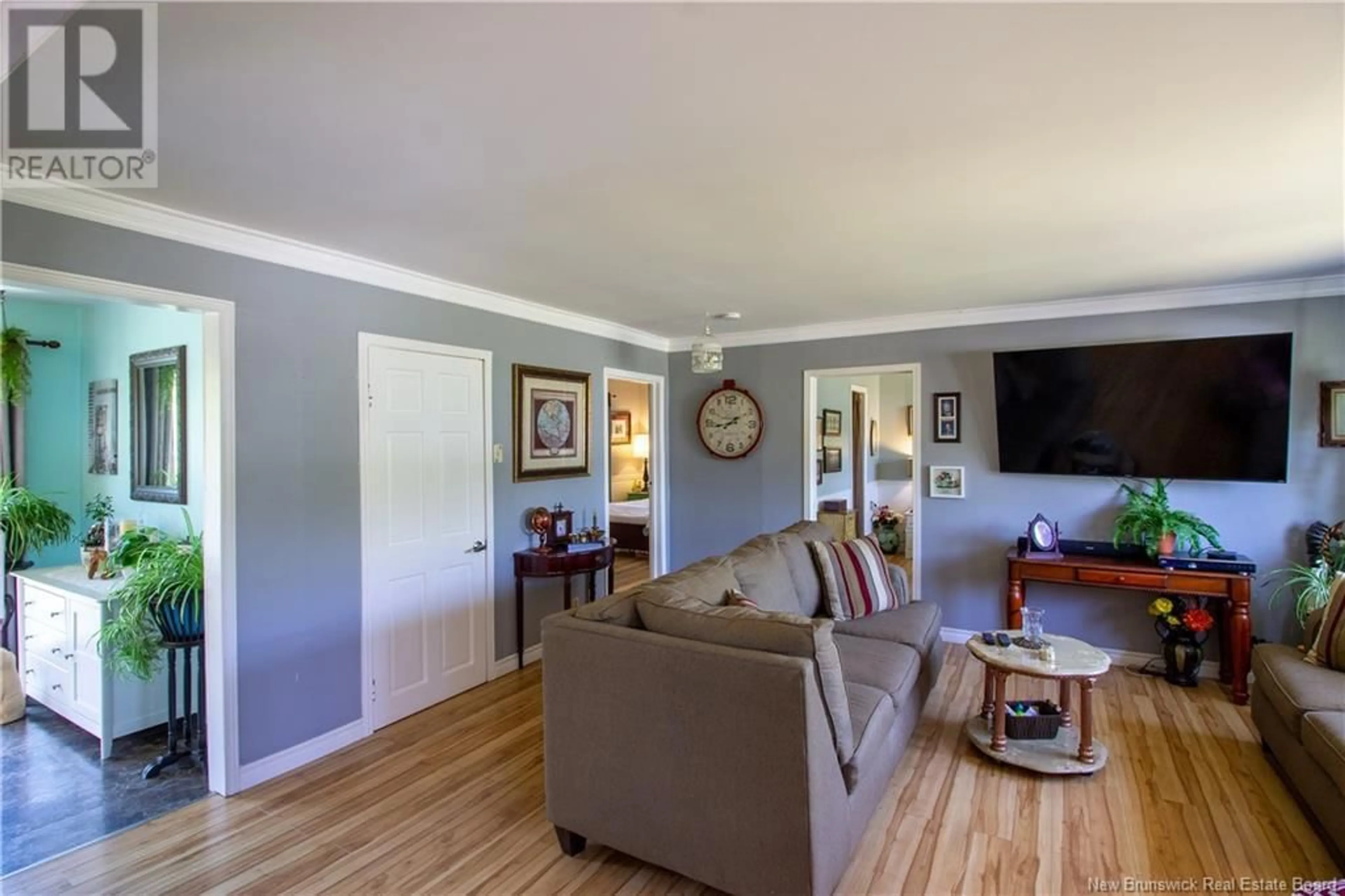 Living room with furniture, wood/laminate floor for 7 OXFORD STREET, Willow Grove New Brunswick E2S1G4