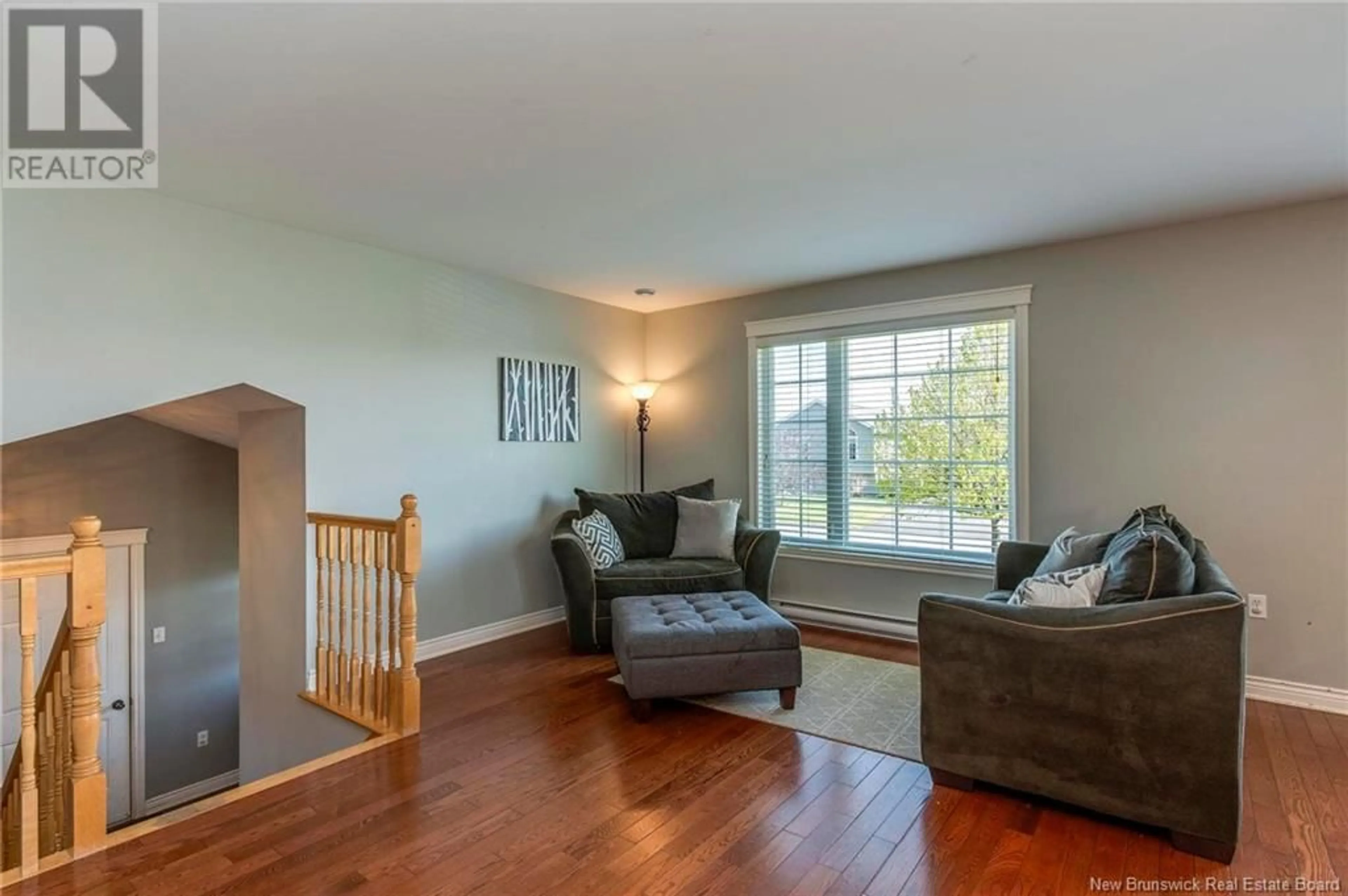 Living room with furniture, wood/laminate floor for 24 LAMDA AVENUE, Saint John New Brunswick E2J0B6