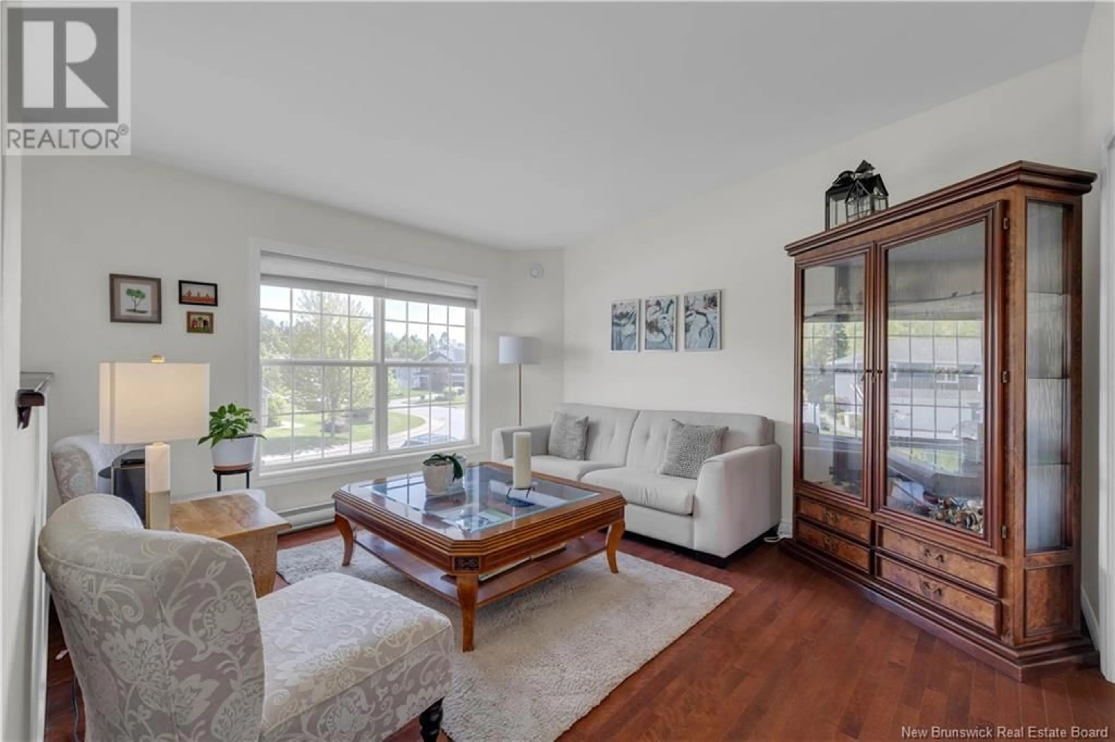 Living room with furniture, wood/laminate floor for 70 MACAULEY AVENUE, Saint John New Brunswick E2K2P7