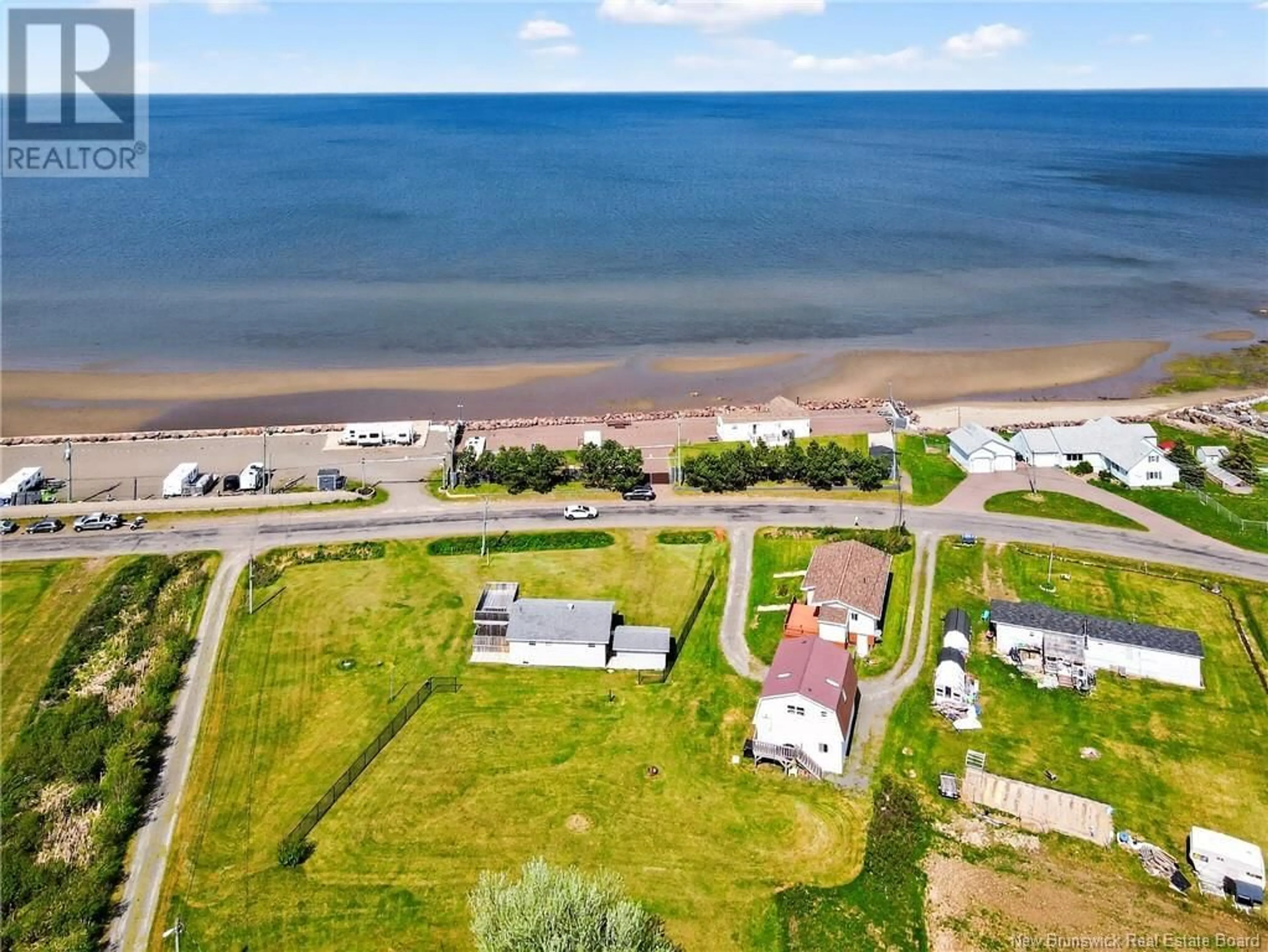 A pic from outside/outdoor area/front of a property/back of a property/a pic from drone, water/lake/river/ocean view for 157 DE LA COTE, Grande-Digue New Brunswick E4R1W8