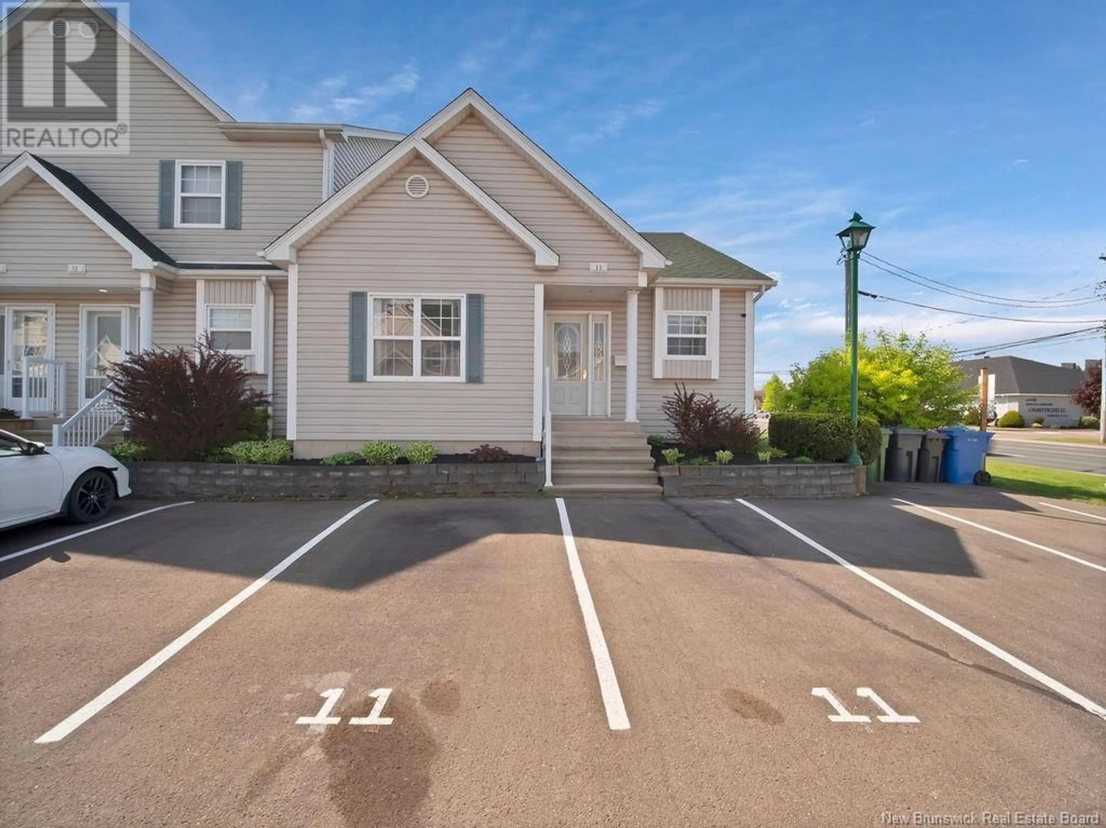 A pic from outside/outdoor area/front of a property/back of a property/a pic from drone, unknown for 11 - 354 RUE AMIRAULT STREET, Dieppe New Brunswick E4R1S9