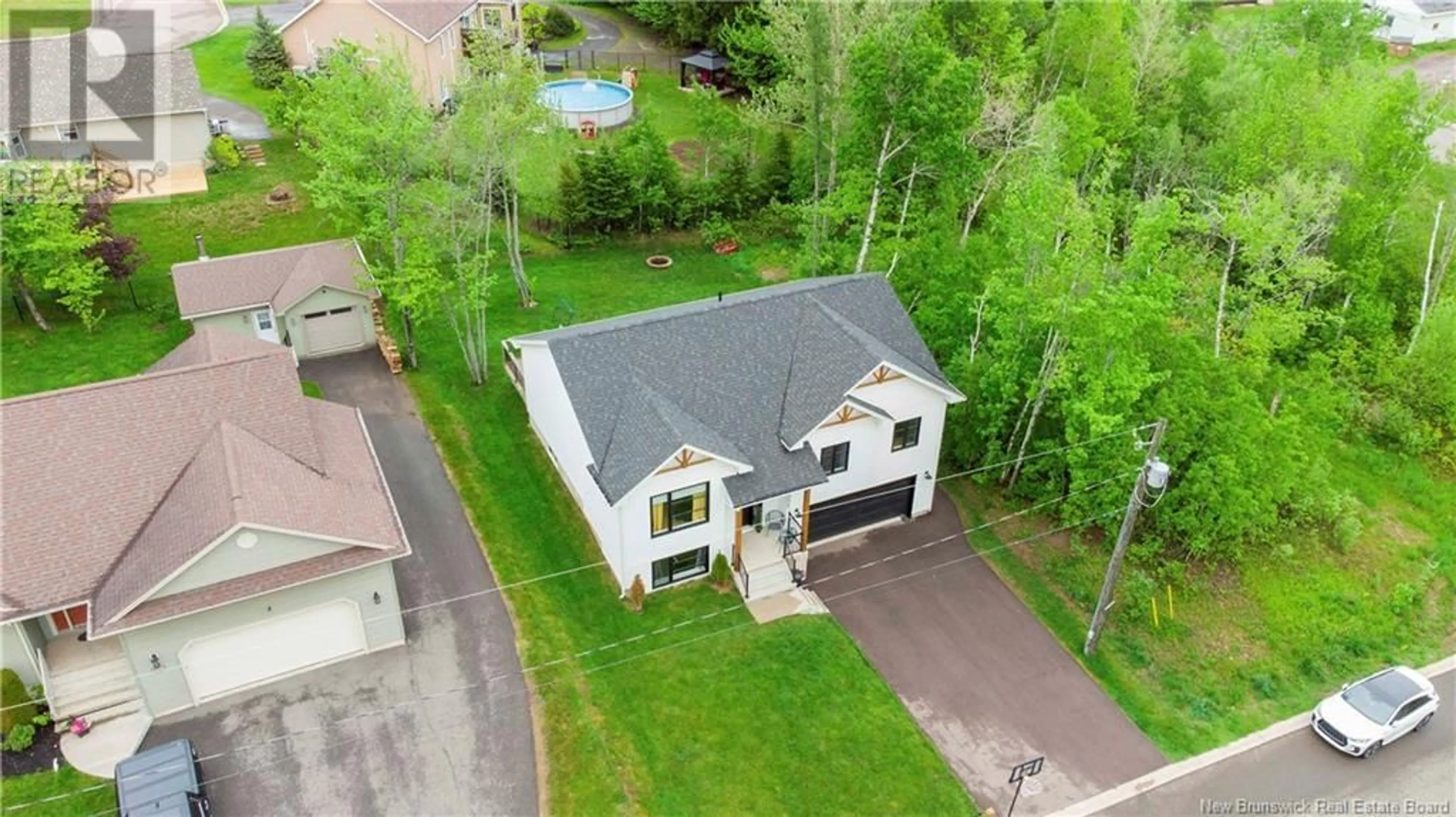 A pic from outside/outdoor area/front of a property/back of a property/a pic from drone, street for 244 SAVANNAH DRIVE, Moncton New Brunswick E1A0V1