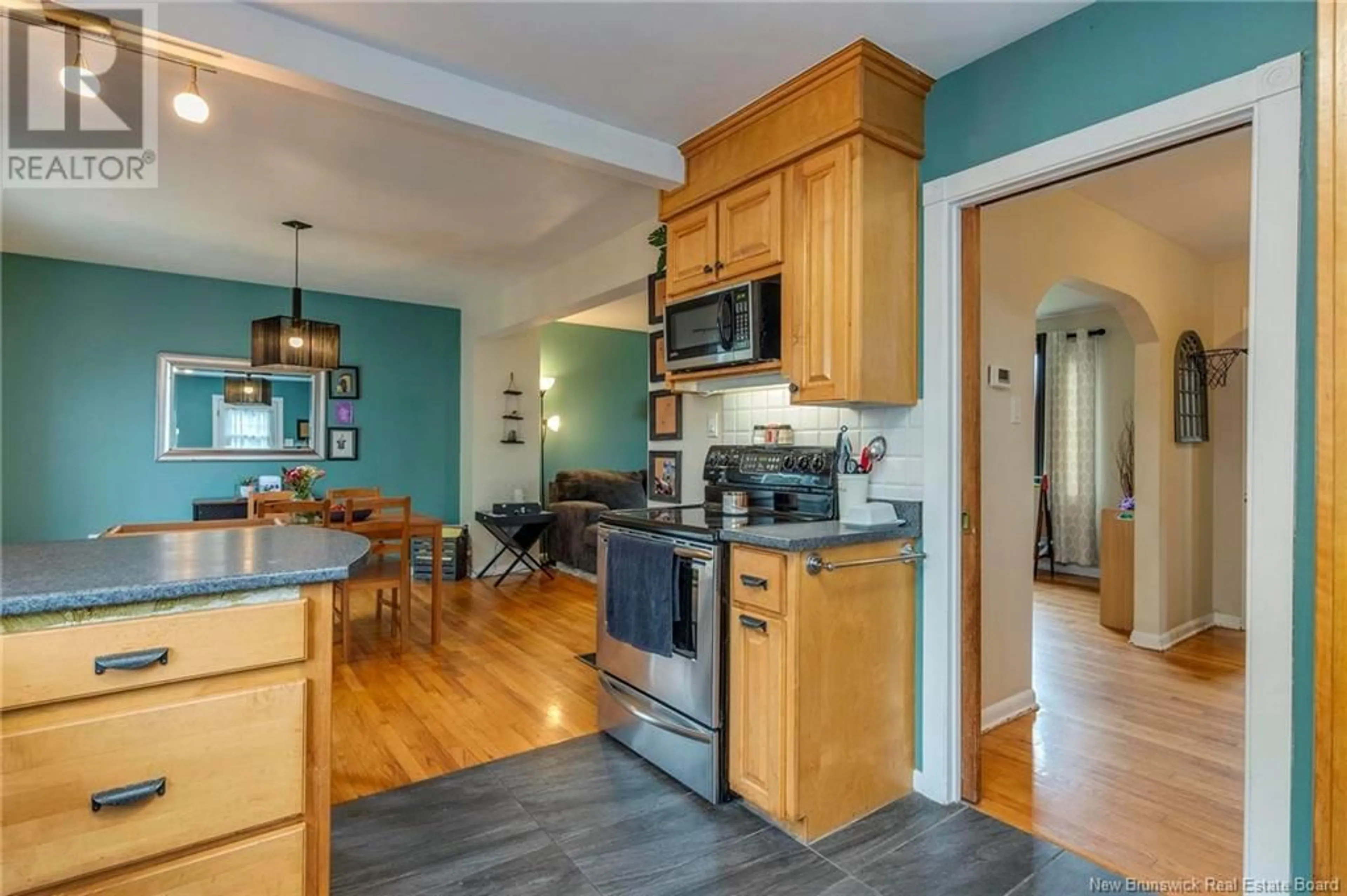 Open concept kitchen, wood/laminate floor for 698 BONNER PLACE, Saint John New Brunswick E2M2K9
