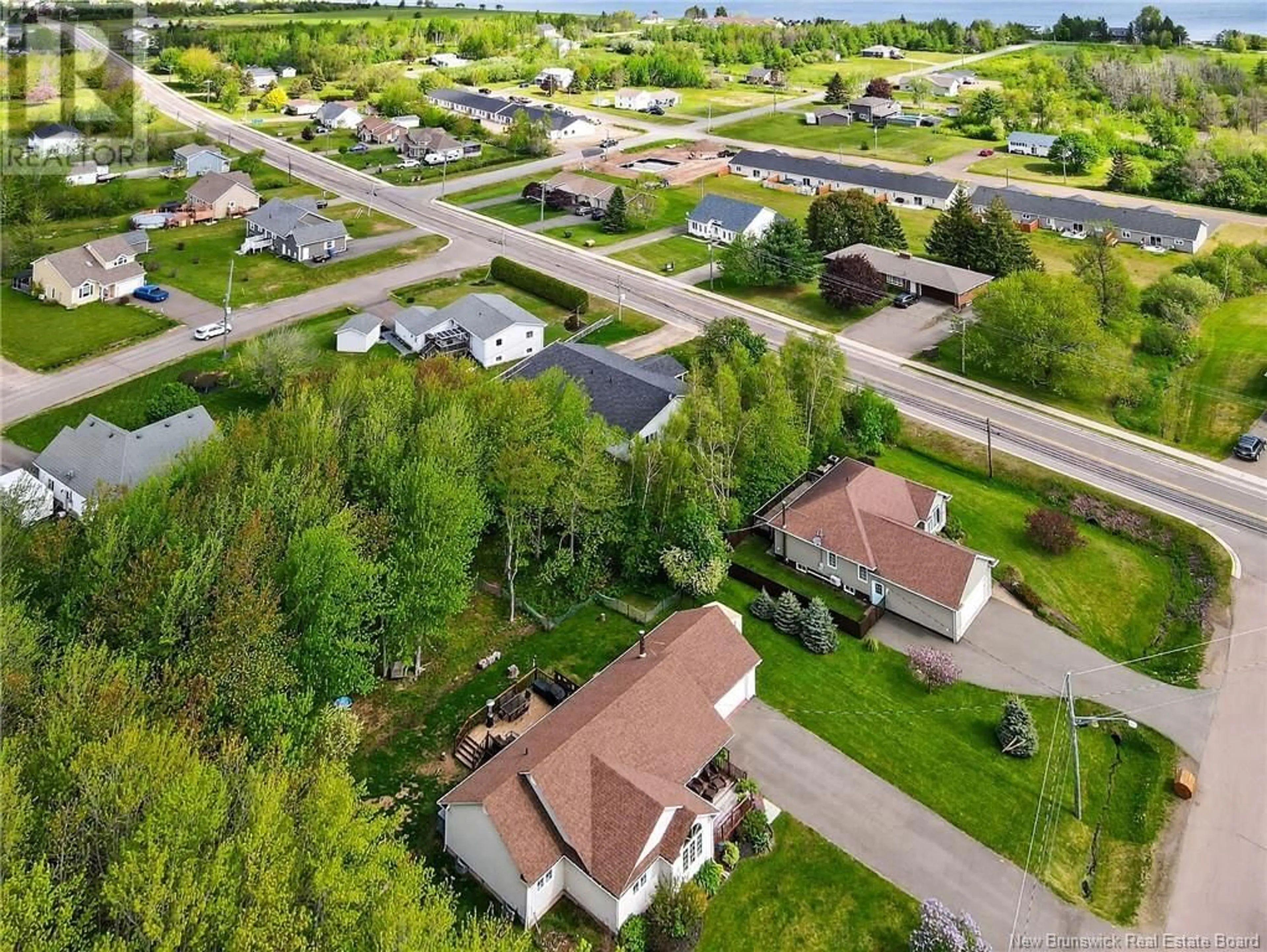A pic from outside/outdoor area/front of a property/back of a property/a pic from drone, street for 3 IRENE AVENUE, Bouctouche New Brunswick E4S3J2