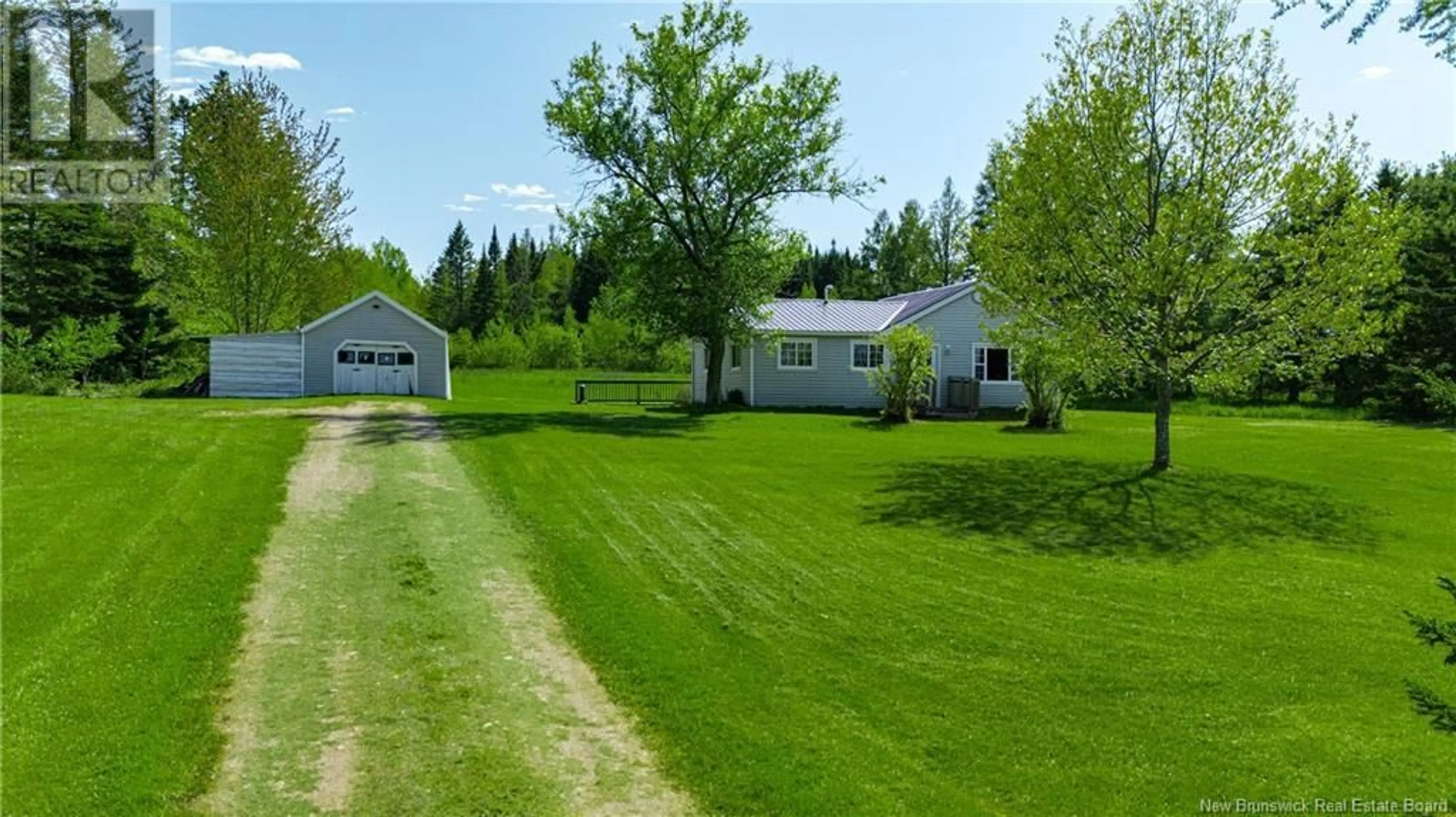A pic from outside/outdoor area/front of a property/back of a property/a pic from drone, unknown for 205 RIVERSIDE DRIVE, Fredericton Junction New Brunswick E5L1W1