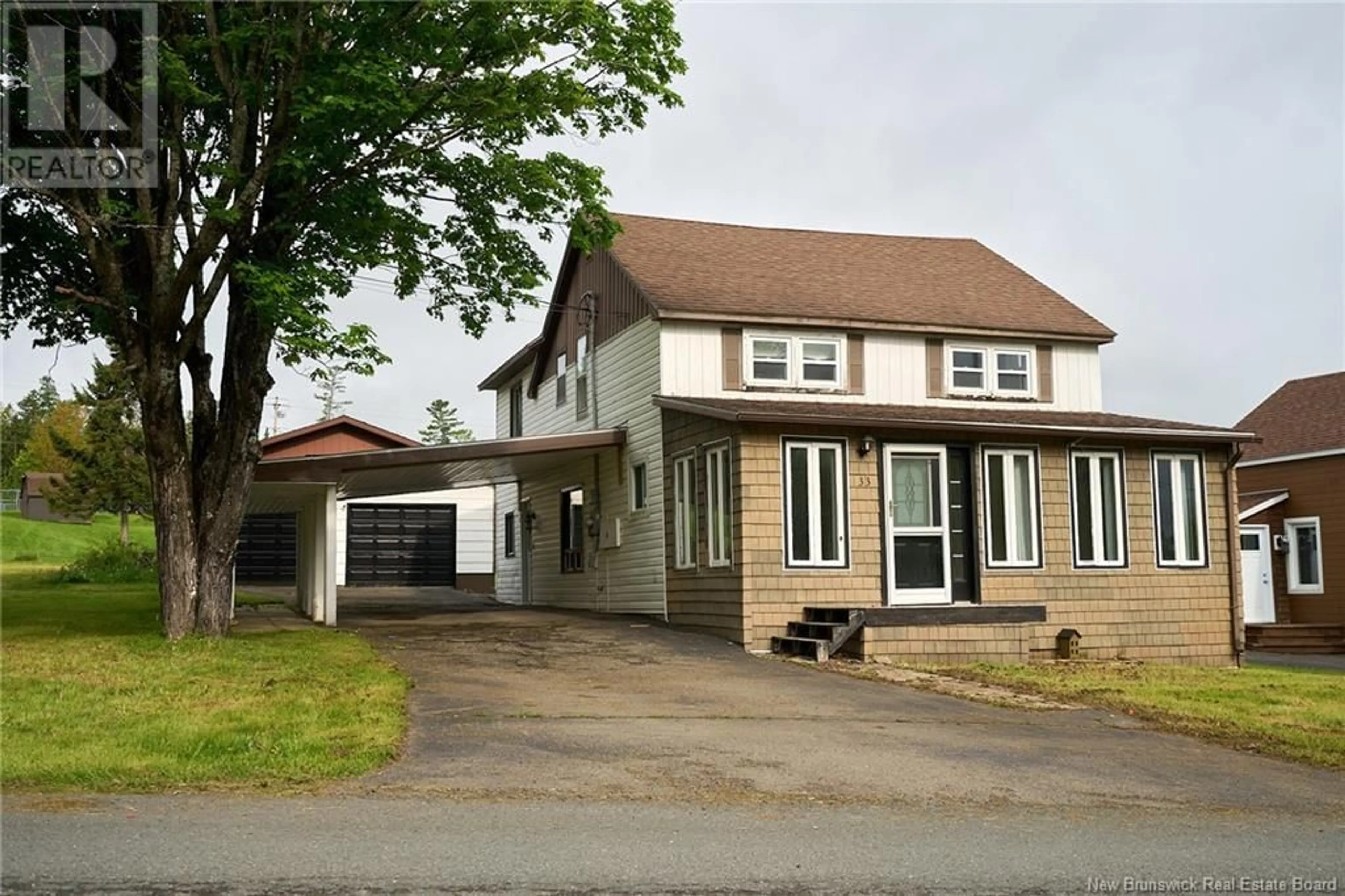 Home with vinyl exterior material, street for 33 ROULSTON AVENUE, Plaster Rock New Brunswick E7G2R3