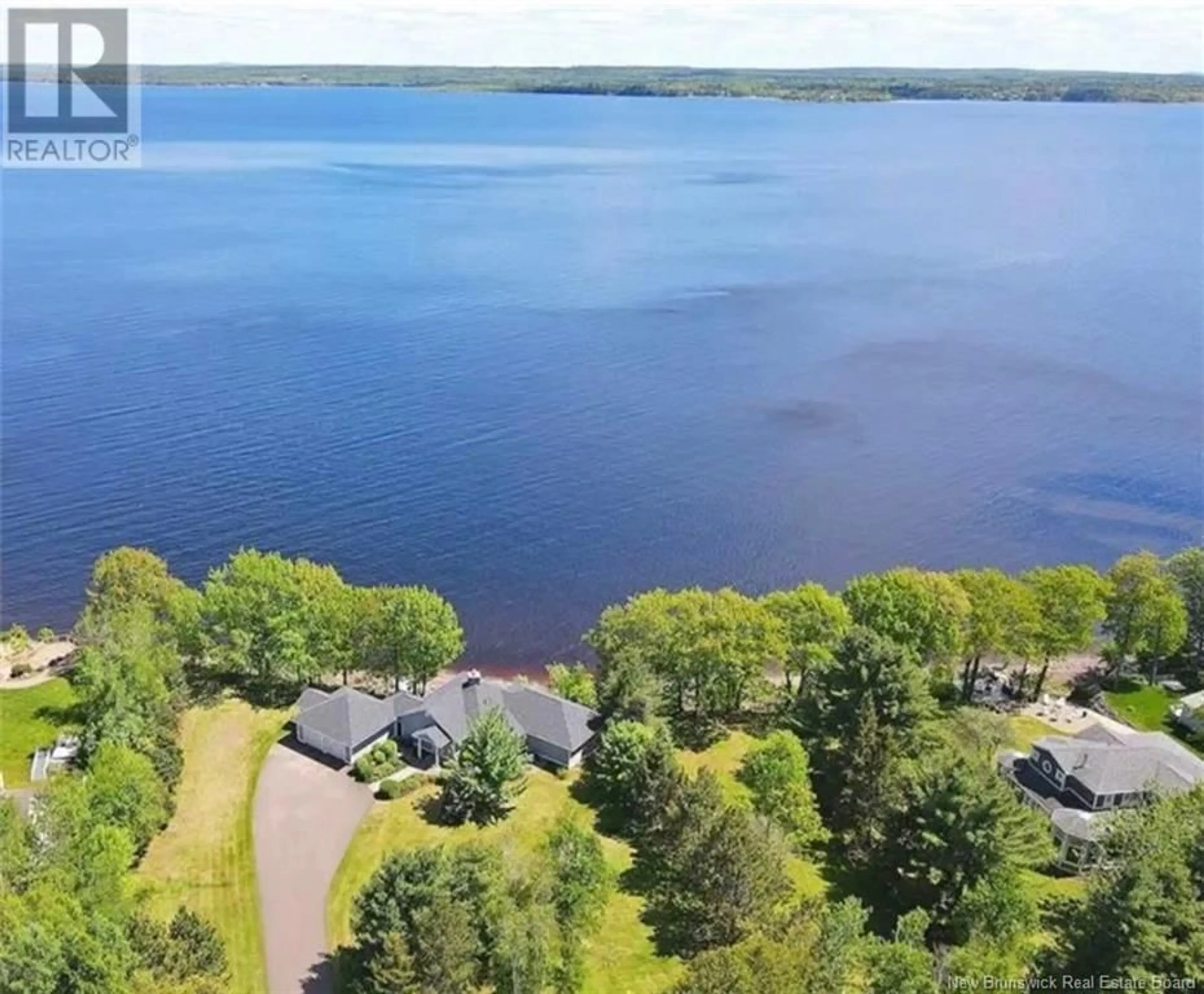 A pic from outside/outdoor area/front of a property/back of a property/a pic from drone, water/lake/river/ocean view for 18 COTTAGE LANE, Grand Lake New Brunswick E4B0B5