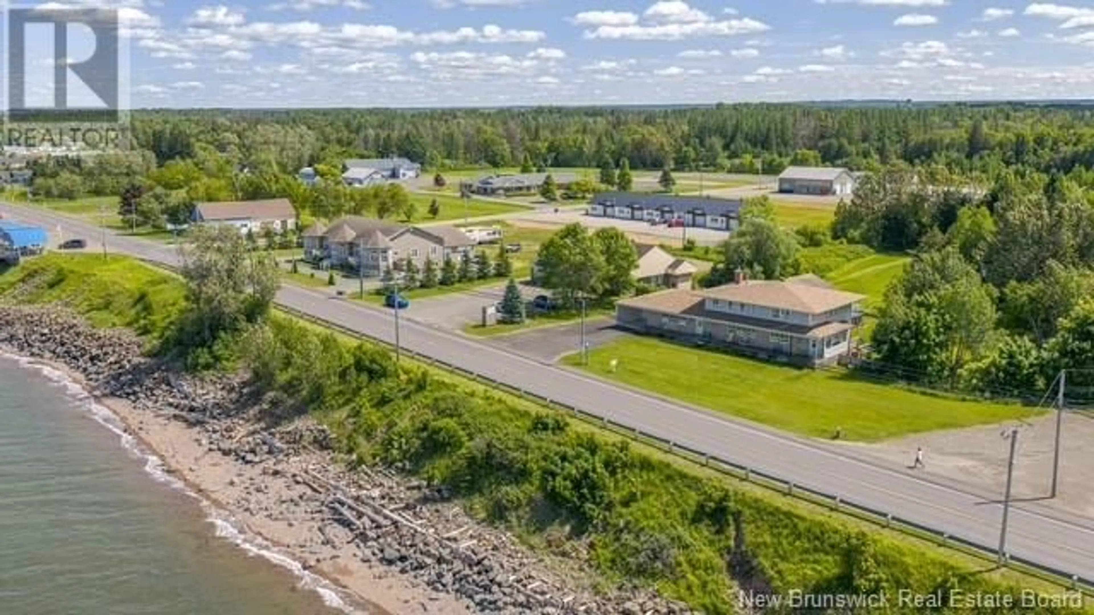 A pic from outside/outdoor area/front of a property/back of a property/a pic from drone, water/lake/river/ocean view for 326 CHALEUR STREET, Charlo New Brunswick E8E2G2