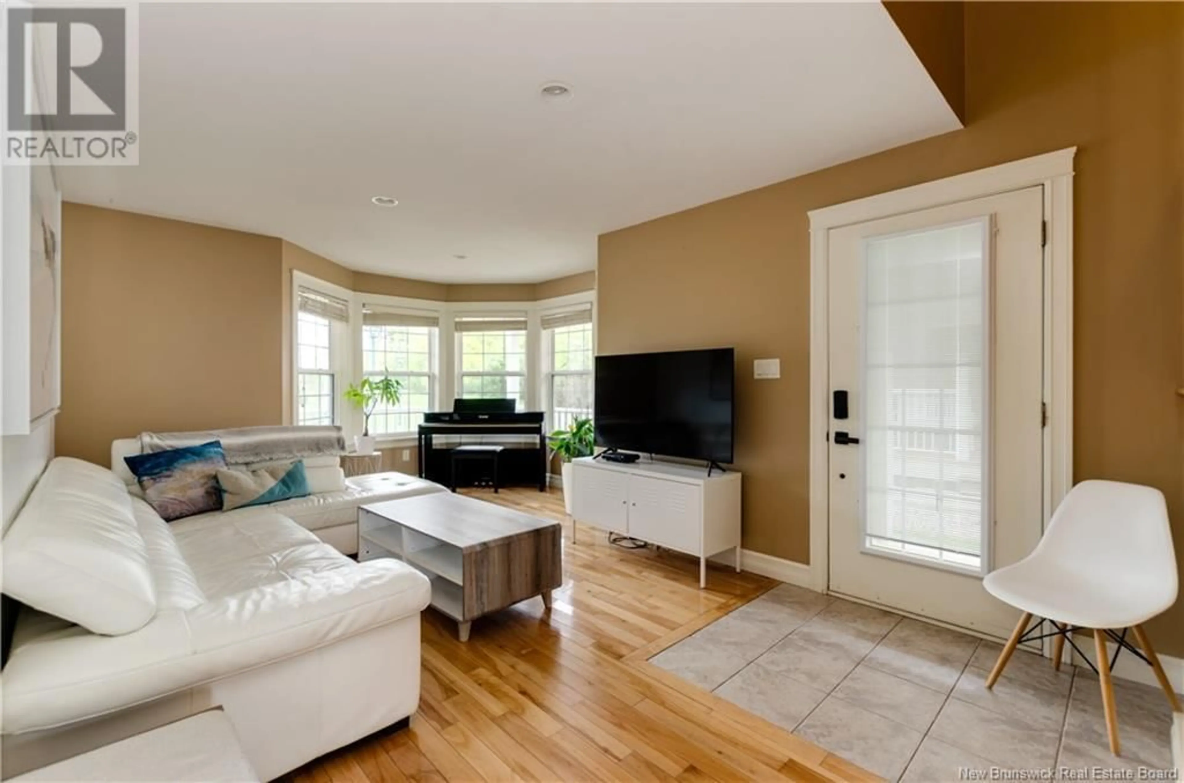 Living room with furniture, wood/laminate floor for 136 ROYAL OAKS BOULEVARD, Moncton New Brunswick E1H3S4