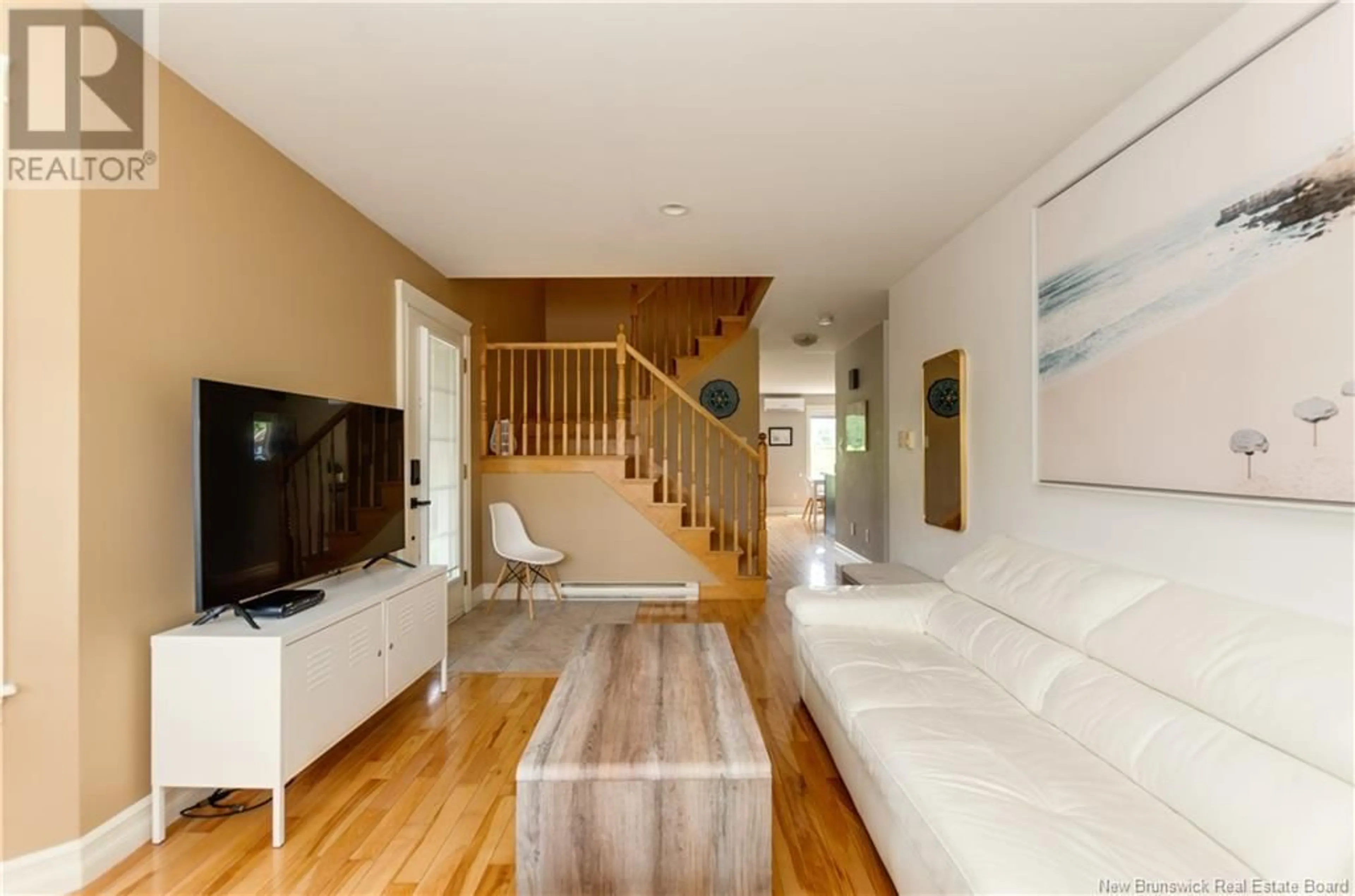 Living room with furniture, wood/laminate floor for 136 ROYAL OAKS BOULEVARD, Moncton New Brunswick E1H3S4