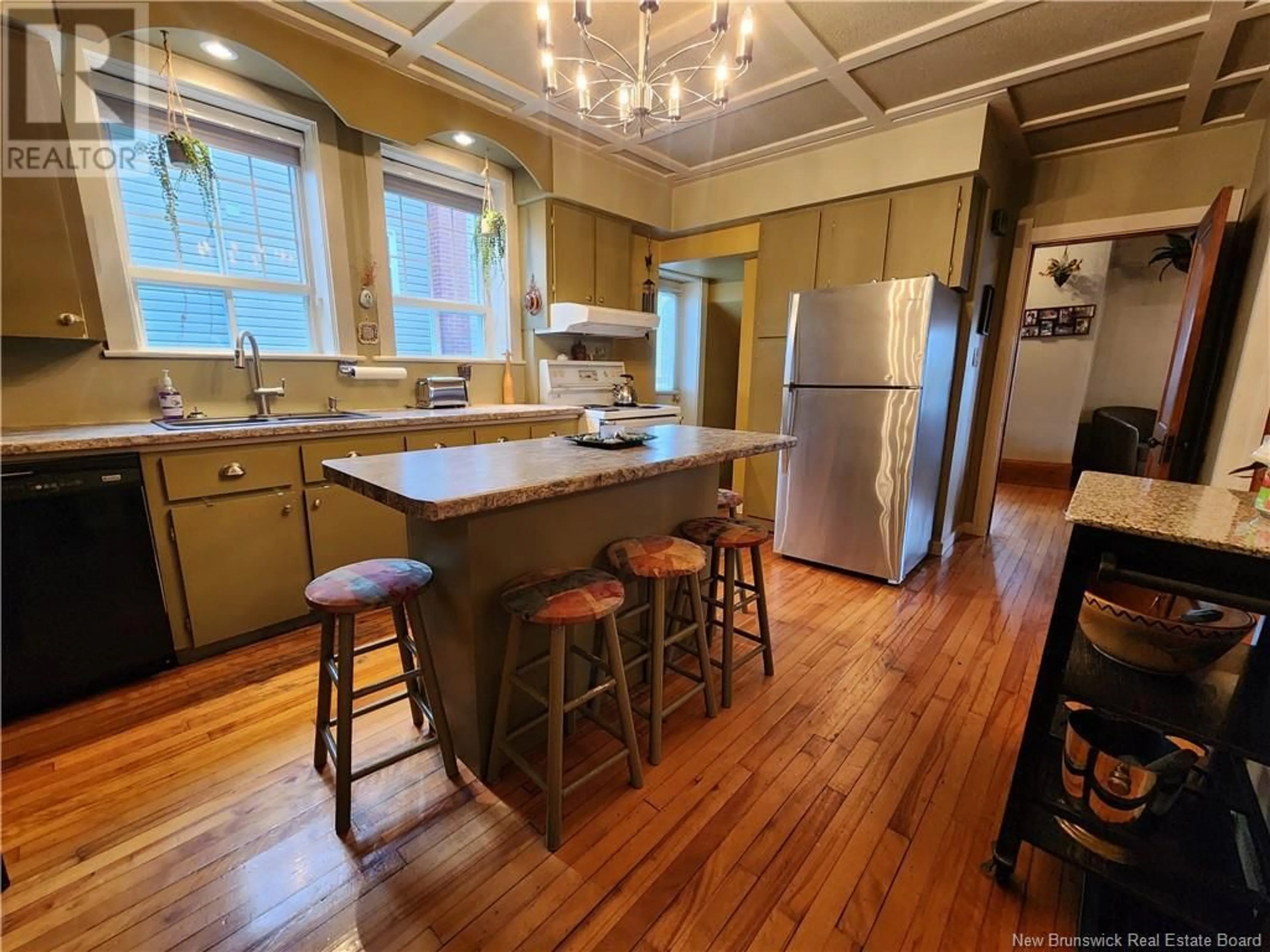 Open concept kitchen, wood/laminate floor for 22 CYR STREET, Saint-Léonard New Brunswick E7E1X7