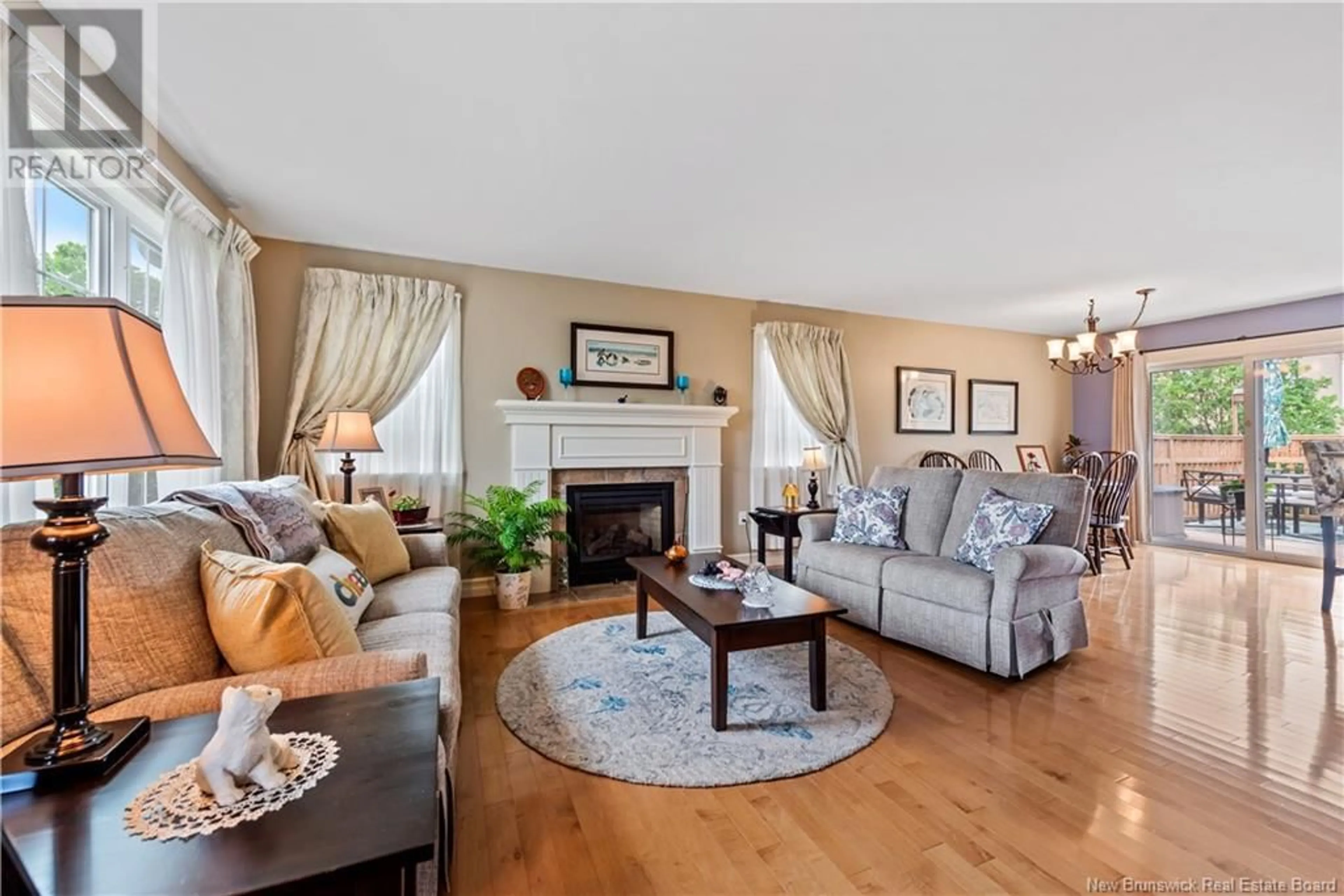 Living room with furniture, wood/laminate floor for 24 CRAWFORD STREET, Moncton New Brunswick E1G5N2