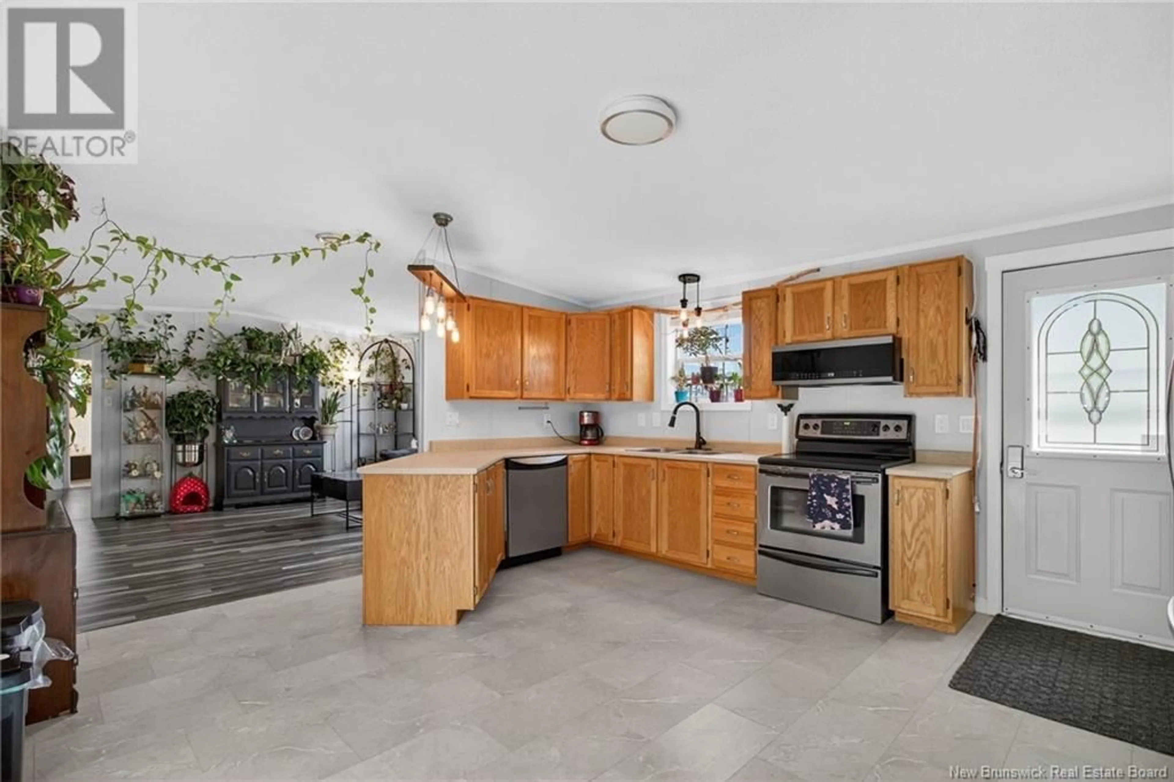 Open concept kitchen, ceramic/tile floor for 160 NEPISIGUIT DRIVE, Dieppe New Brunswick E1A7N1
