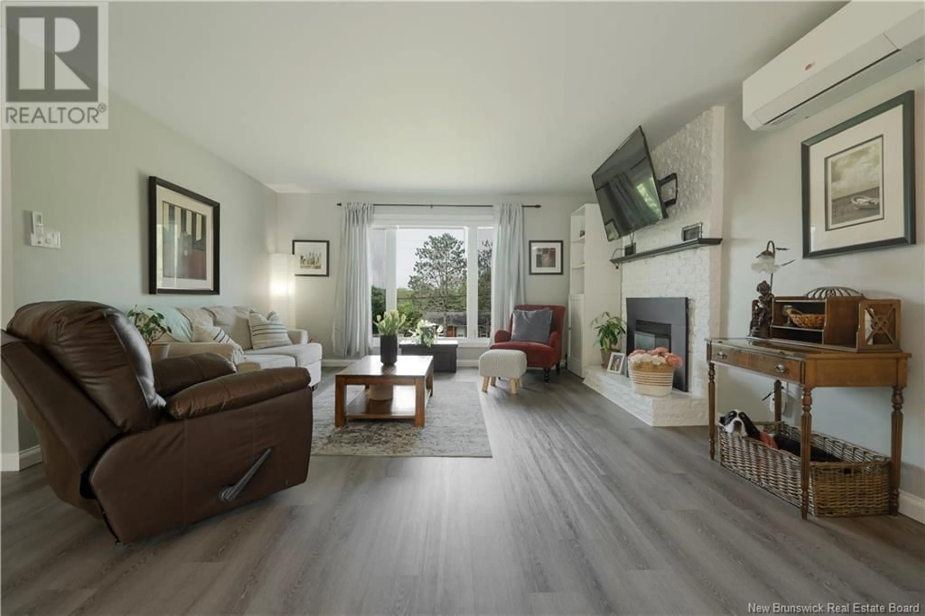 Living room with furniture, wood/laminate floor for 2 WILLOWBRIAR DRIVE, Quispamsis New Brunswick E2G1N3