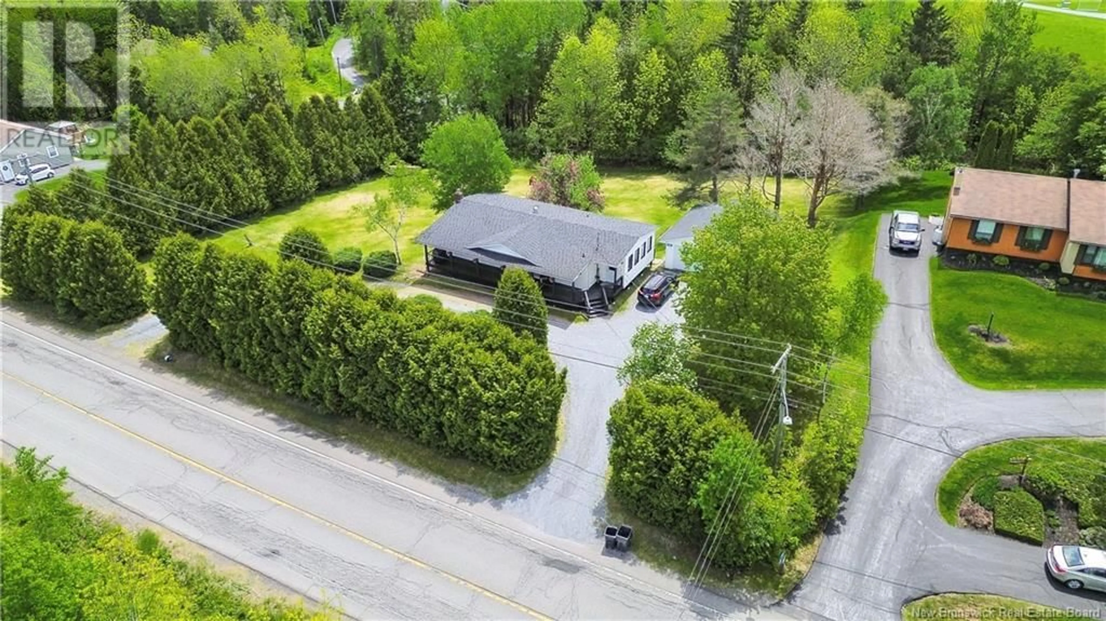 A pic from outside/outdoor area/front of a property/back of a property/a pic from drone, street for 32 MEENANS COVE ROAD, Quispamsis New Brunswick E2E1M7