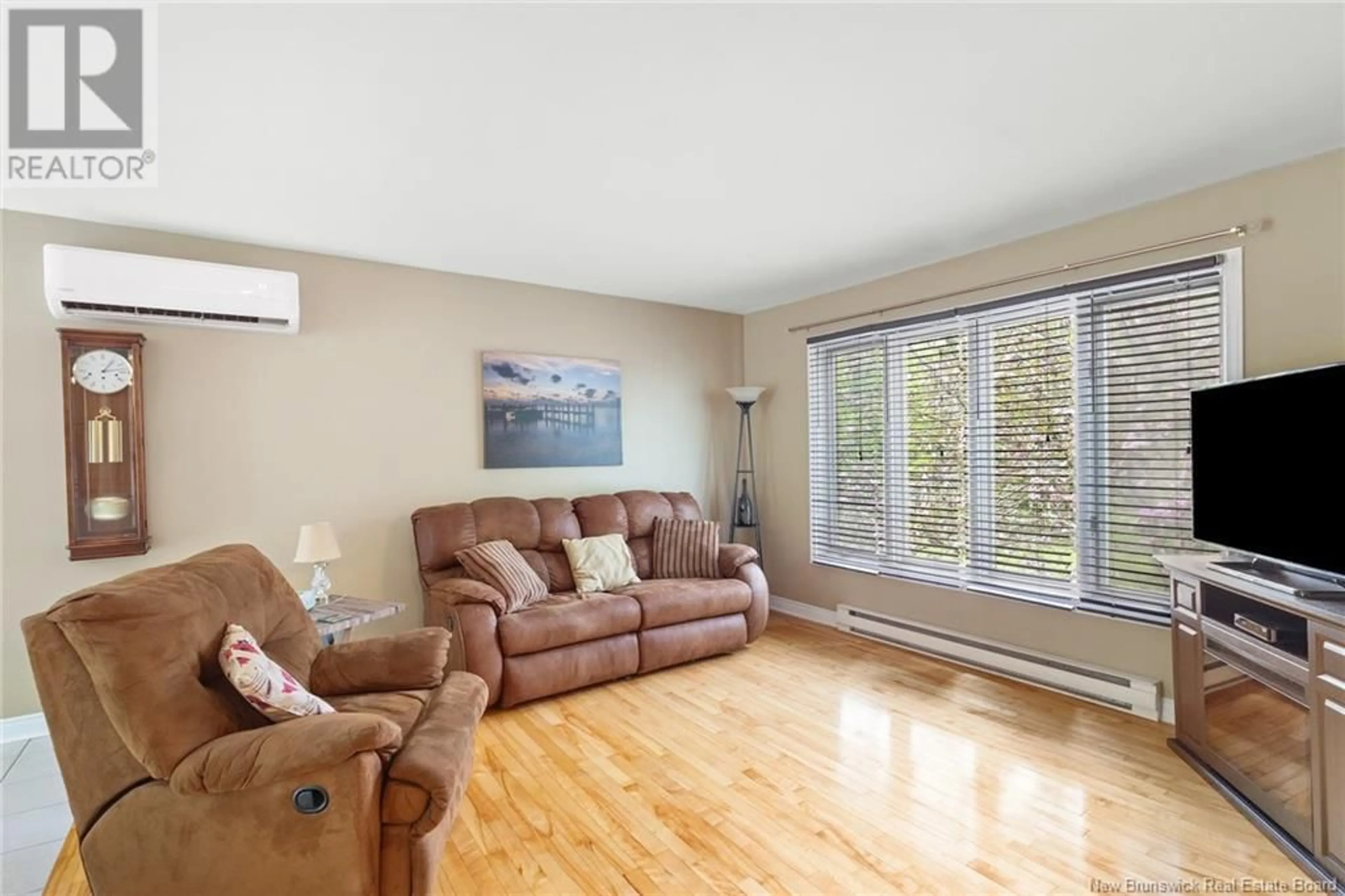 Living room with furniture, wood/laminate floor for 116 FAWN CRESCENT, Hanwell New Brunswick E3E1B5