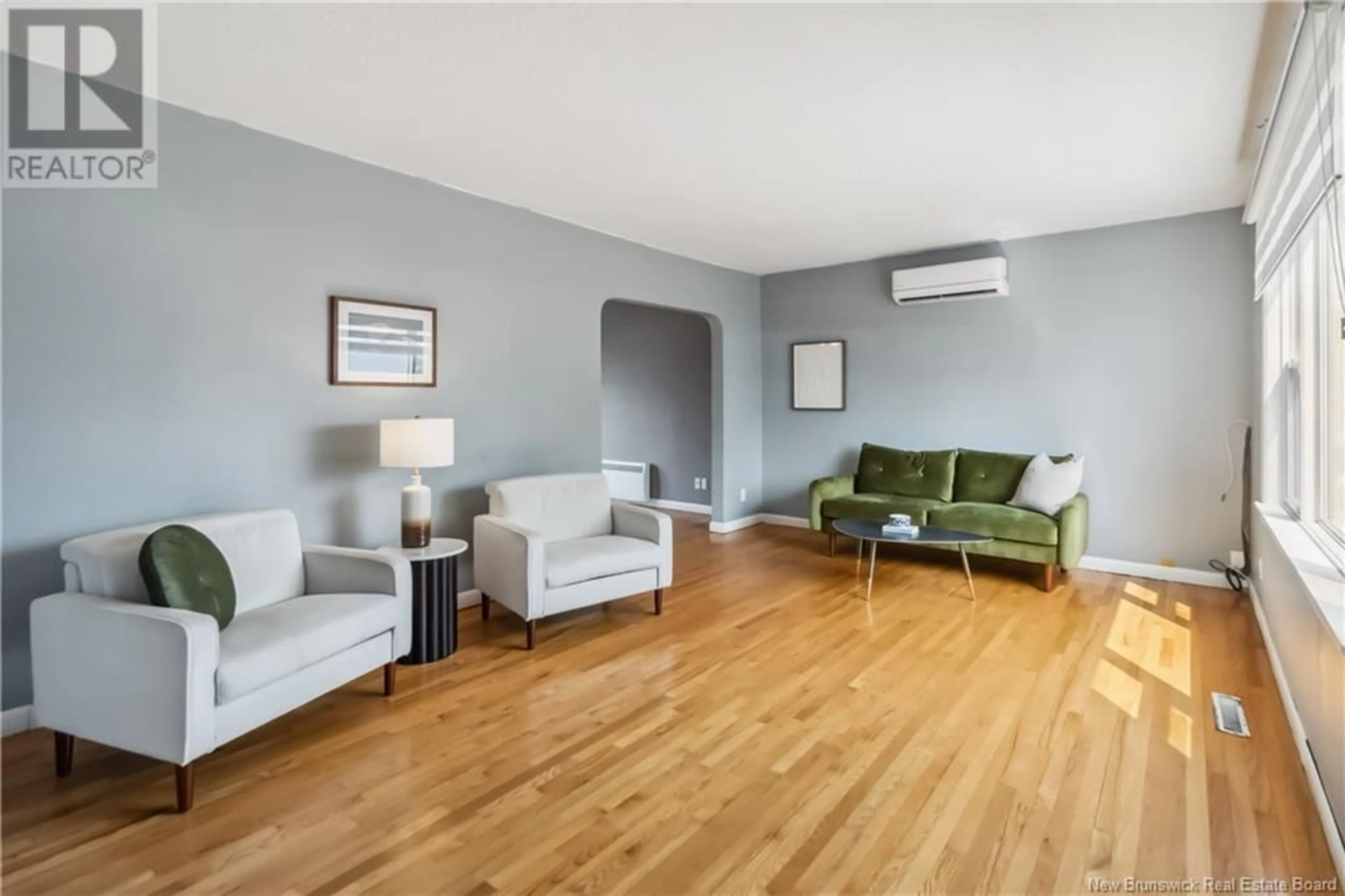 Living room with furniture, wood/laminate floor for 116 EDGETT AVENUE, Moncton New Brunswick E8E1T5
