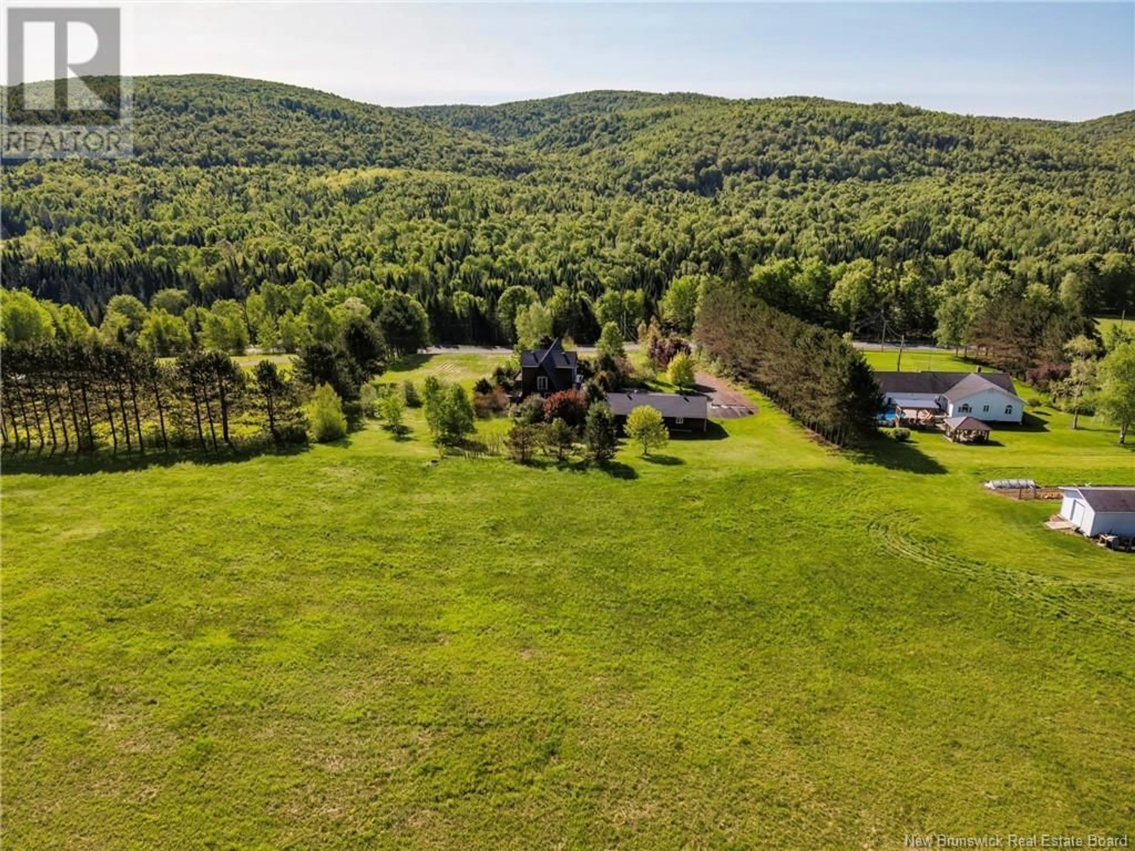 A pic from outside/outdoor area/front of a property/back of a property/a pic from drone, forest/trees view for 13595 ROUTE 105, Tilley New Brunswick E7H4A1