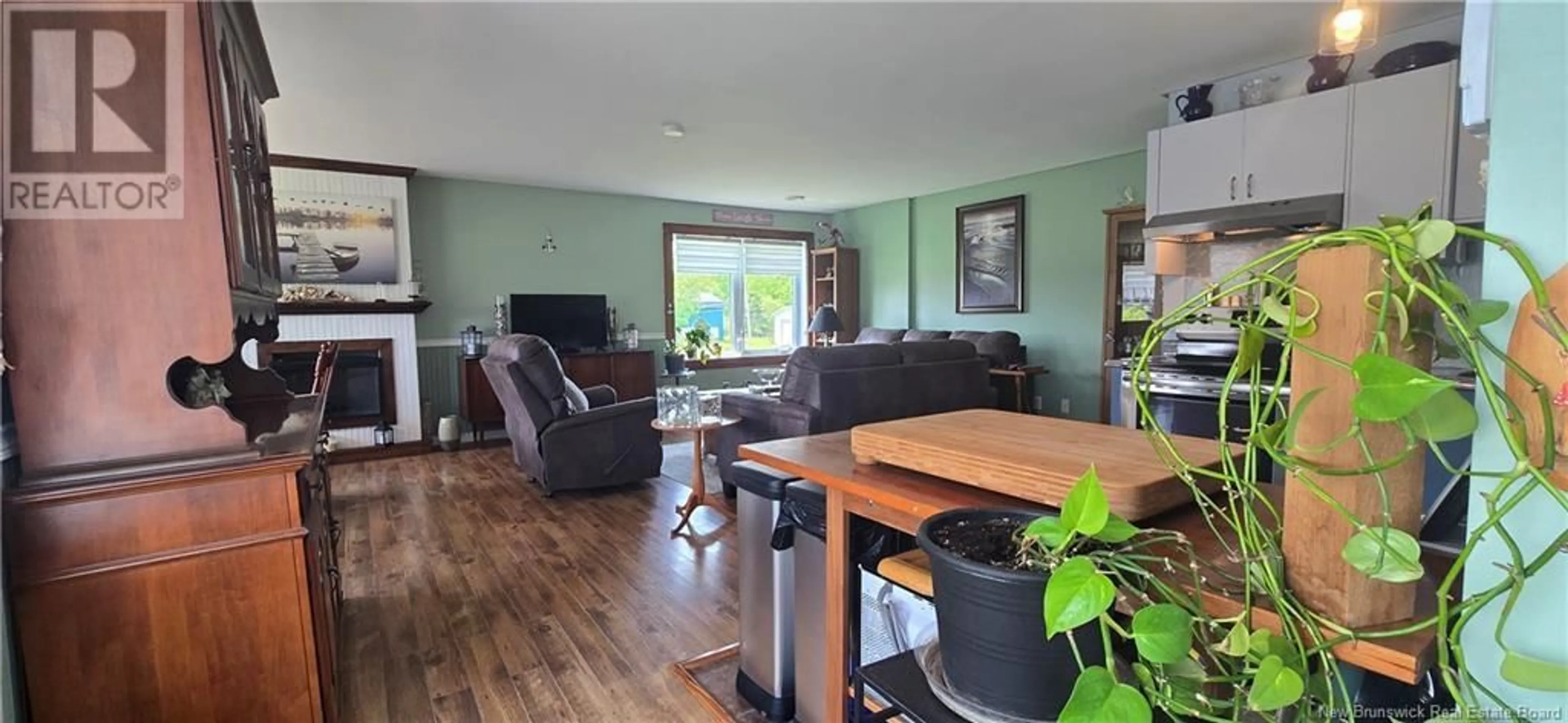 Living room with furniture, wood/laminate floor for 1737 ROUTE 355, Sainte Rose New Brunswick E1X2W5
