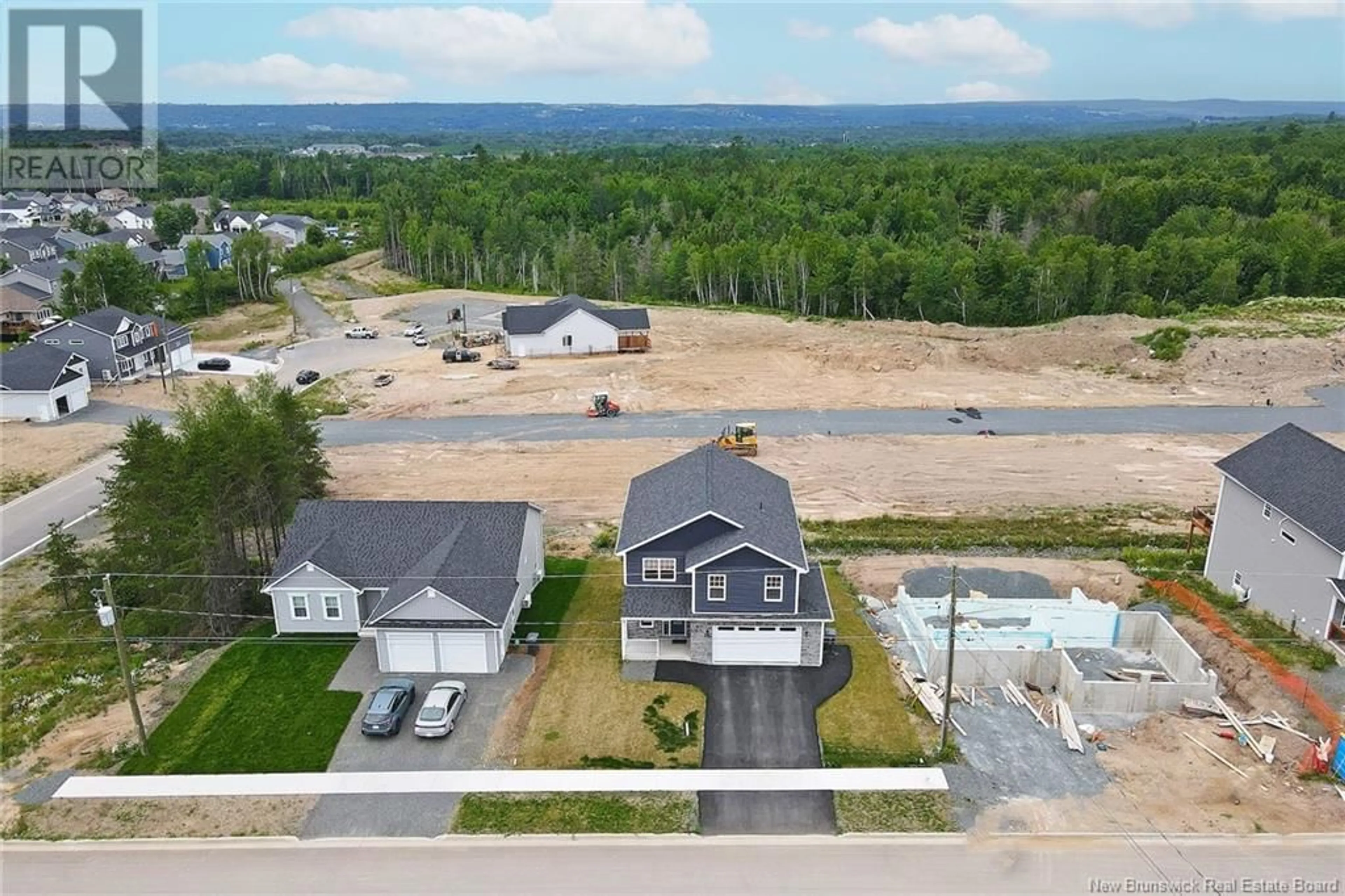 A pic from outside/outdoor area/front of a property/back of a property/a pic from drone, water/lake/river/ocean view for 297 HERON DRIVE, Fredericton New Brunswick E3G0H2